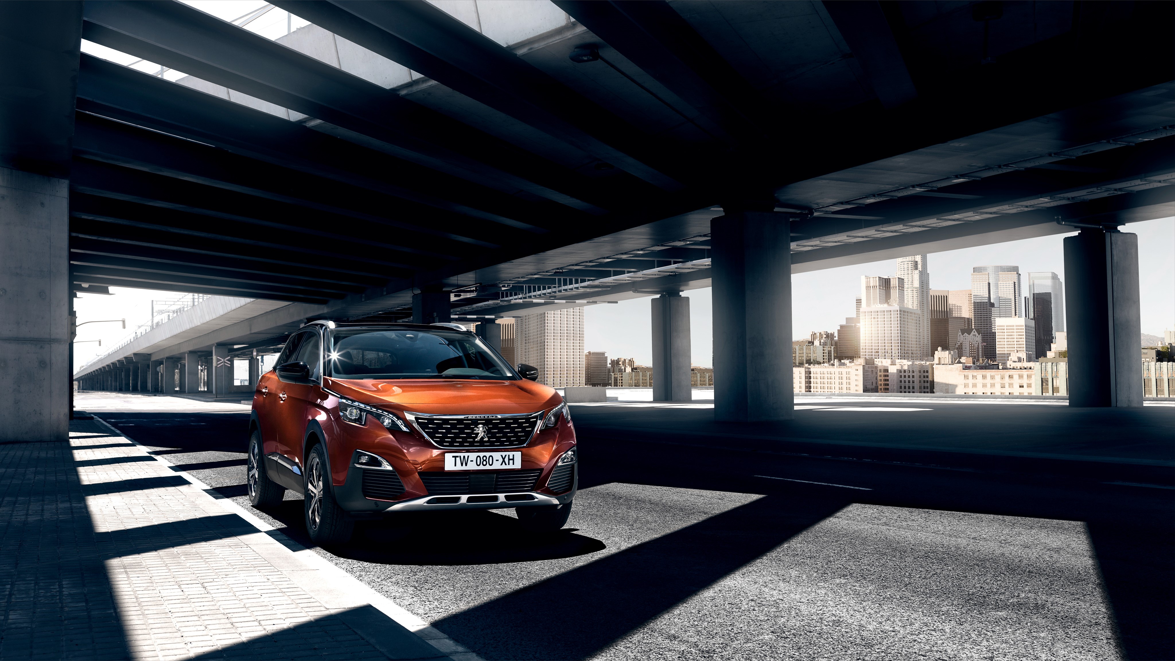 Orange Peugeot 3008 SUV under a bridge HD Wallpaper
