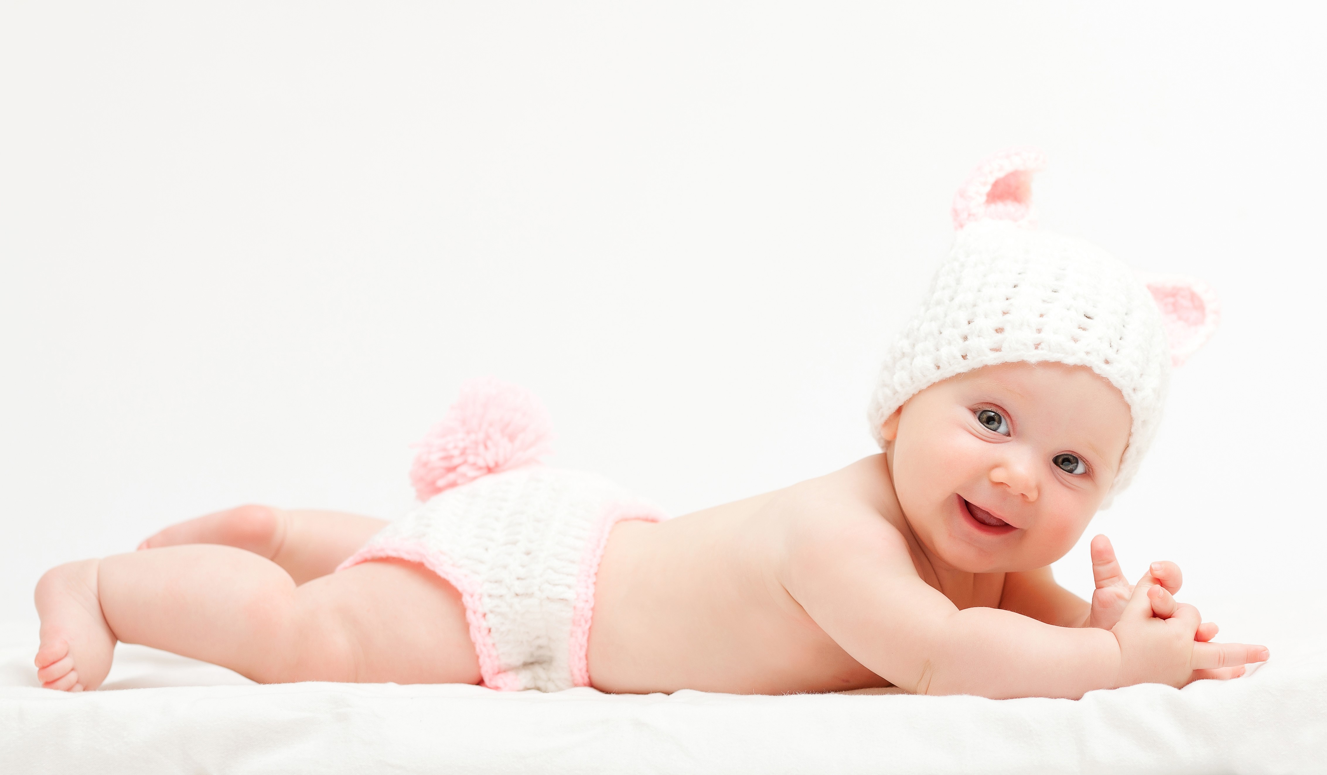 Baby in a white knitted hat with ears and diaper HD Wallpaper