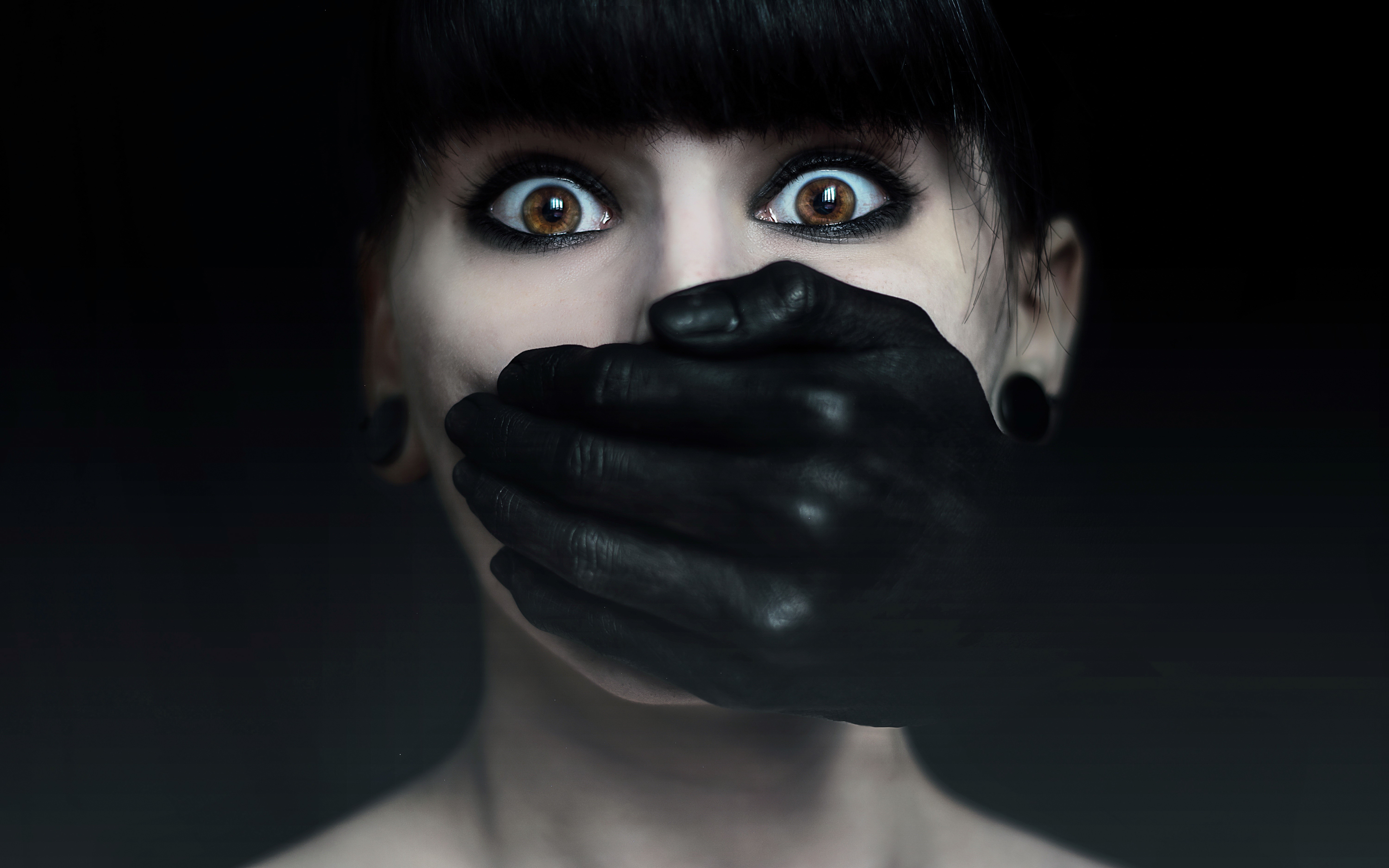 Woman with black hand covering mouth HD Wallpaper