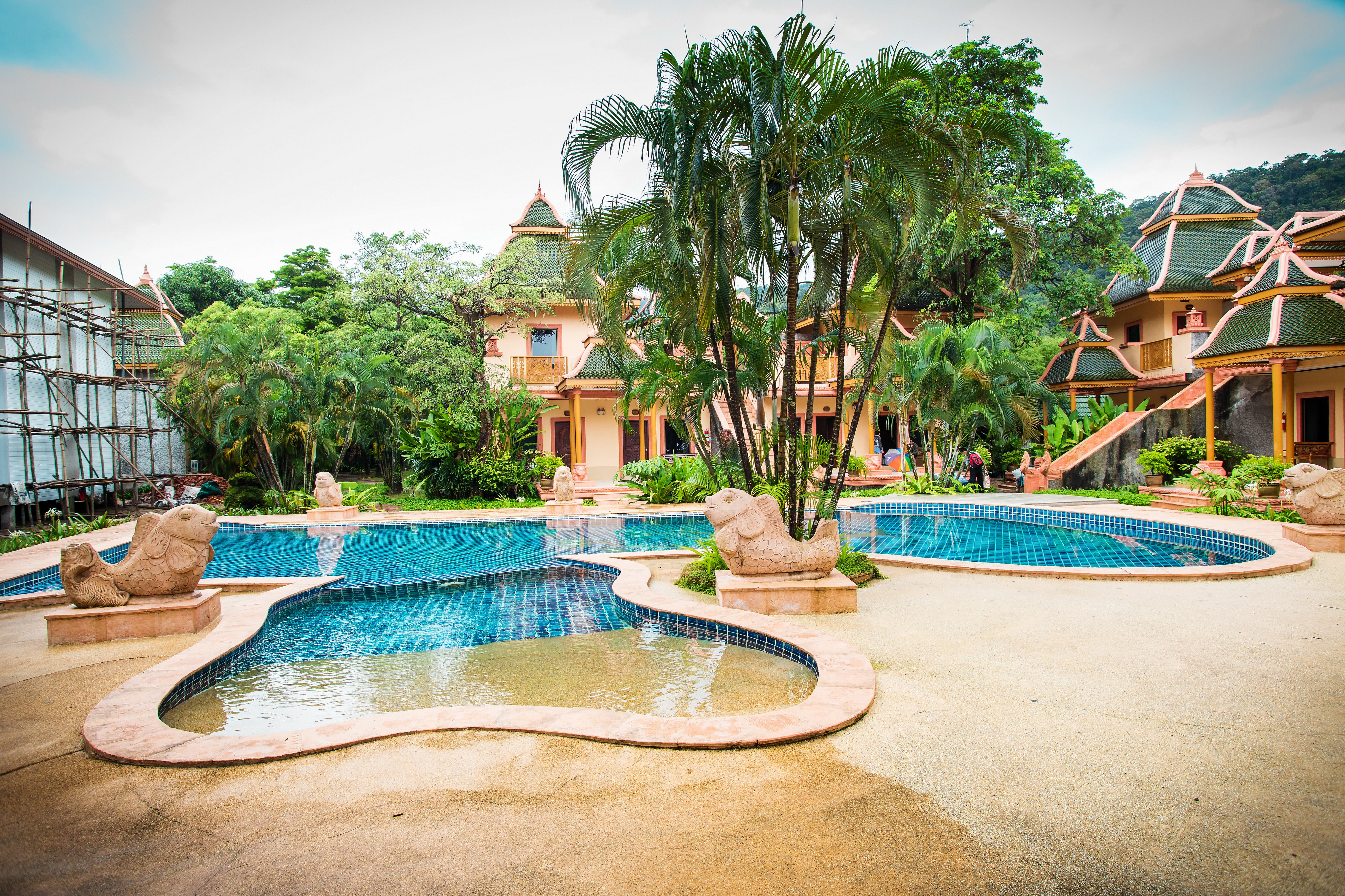 Tropical resort with pools and palm trees HD Wallpaper