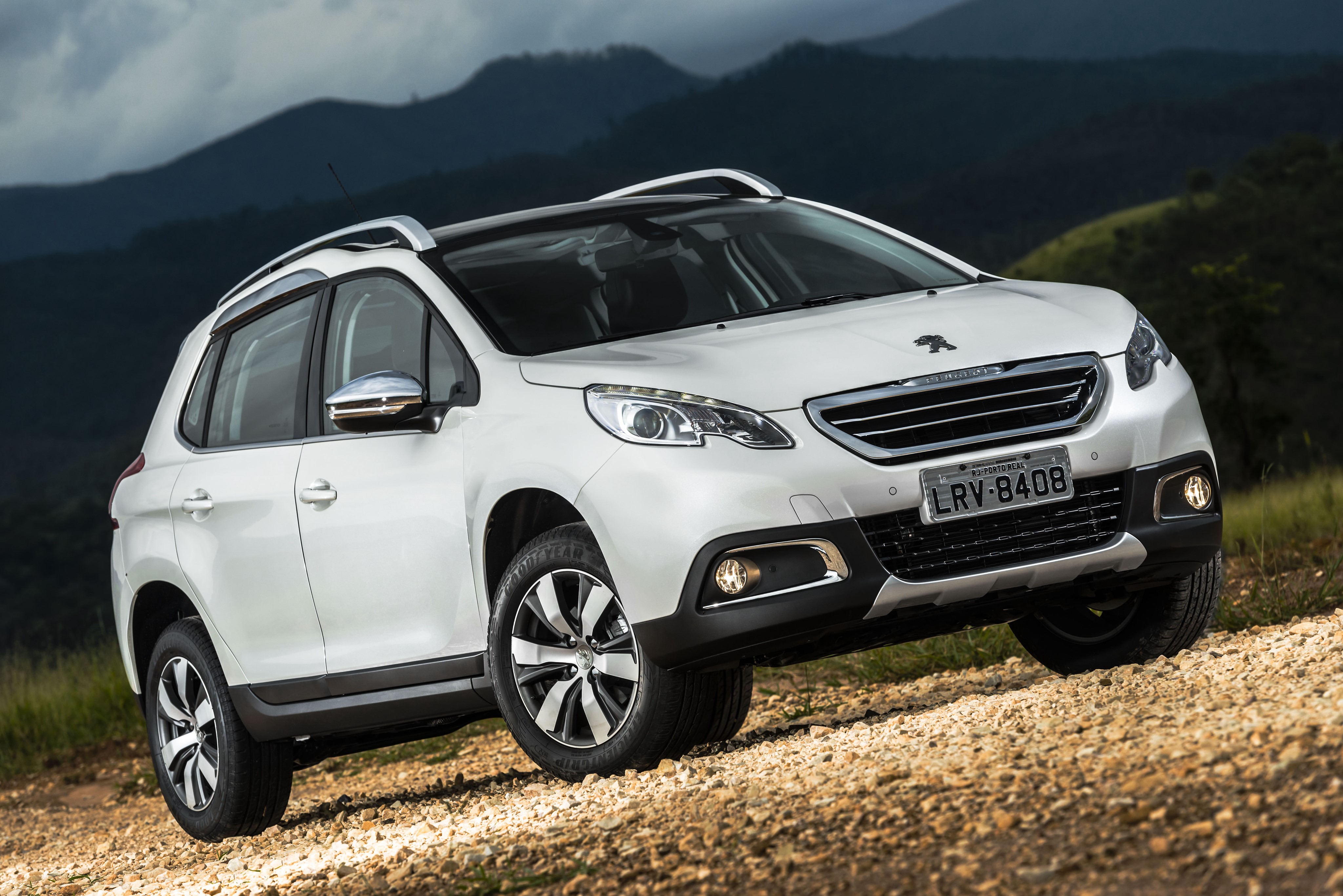 White Peugeot 2008 SUV on a dirt road HD Wallpaper