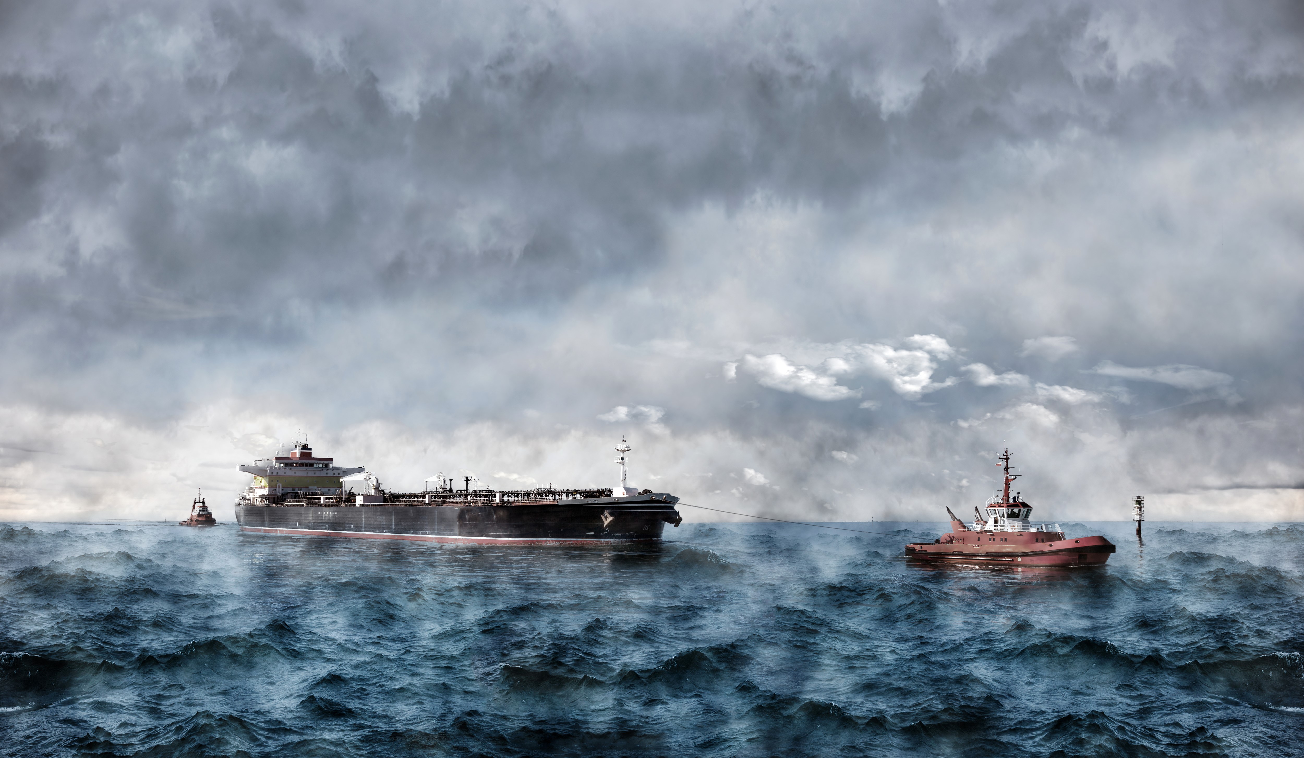Tanker ship being towed by tugboat in rough seas HD Wallpaper