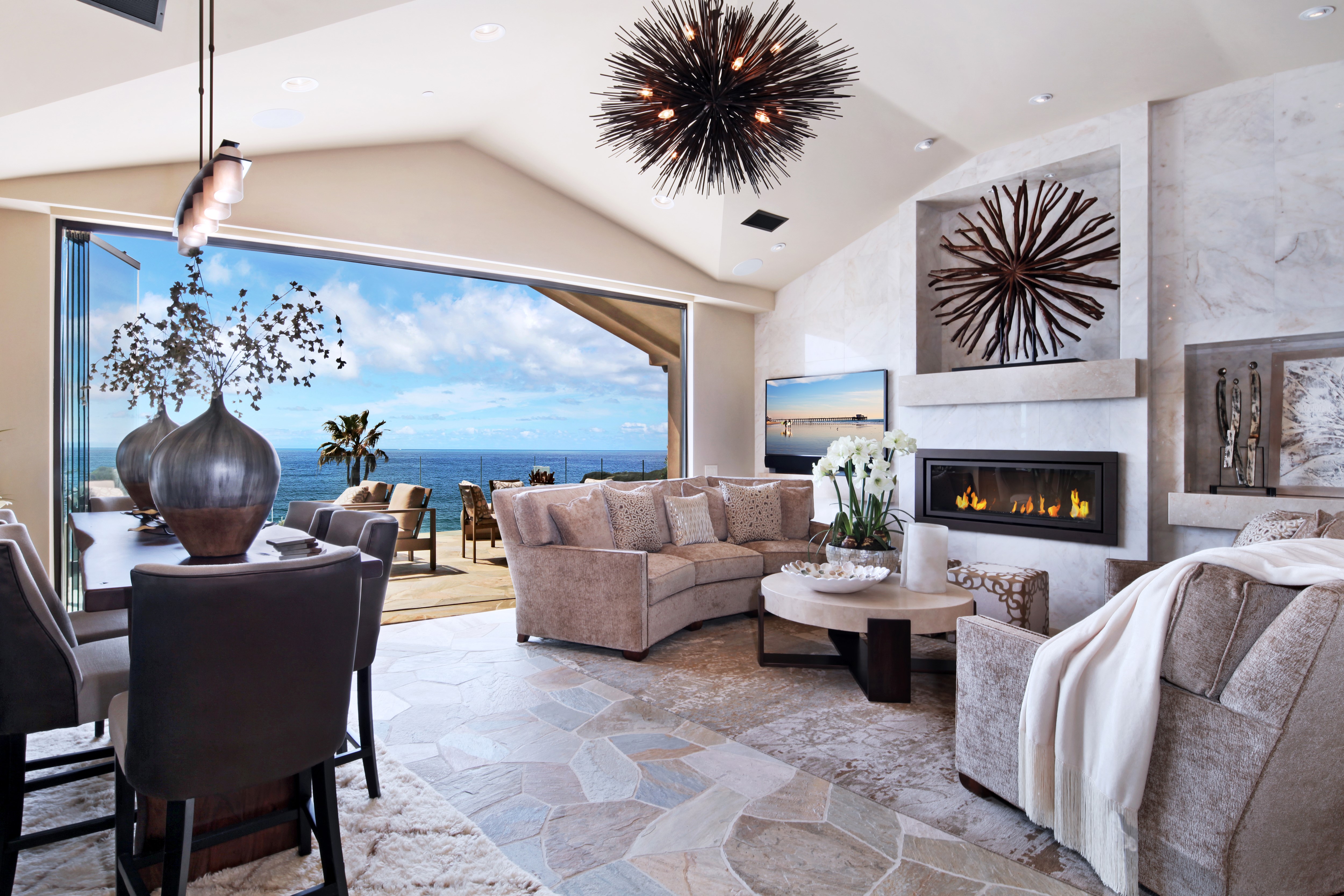Living room with ocean view and fireplace HD Wallpaper
