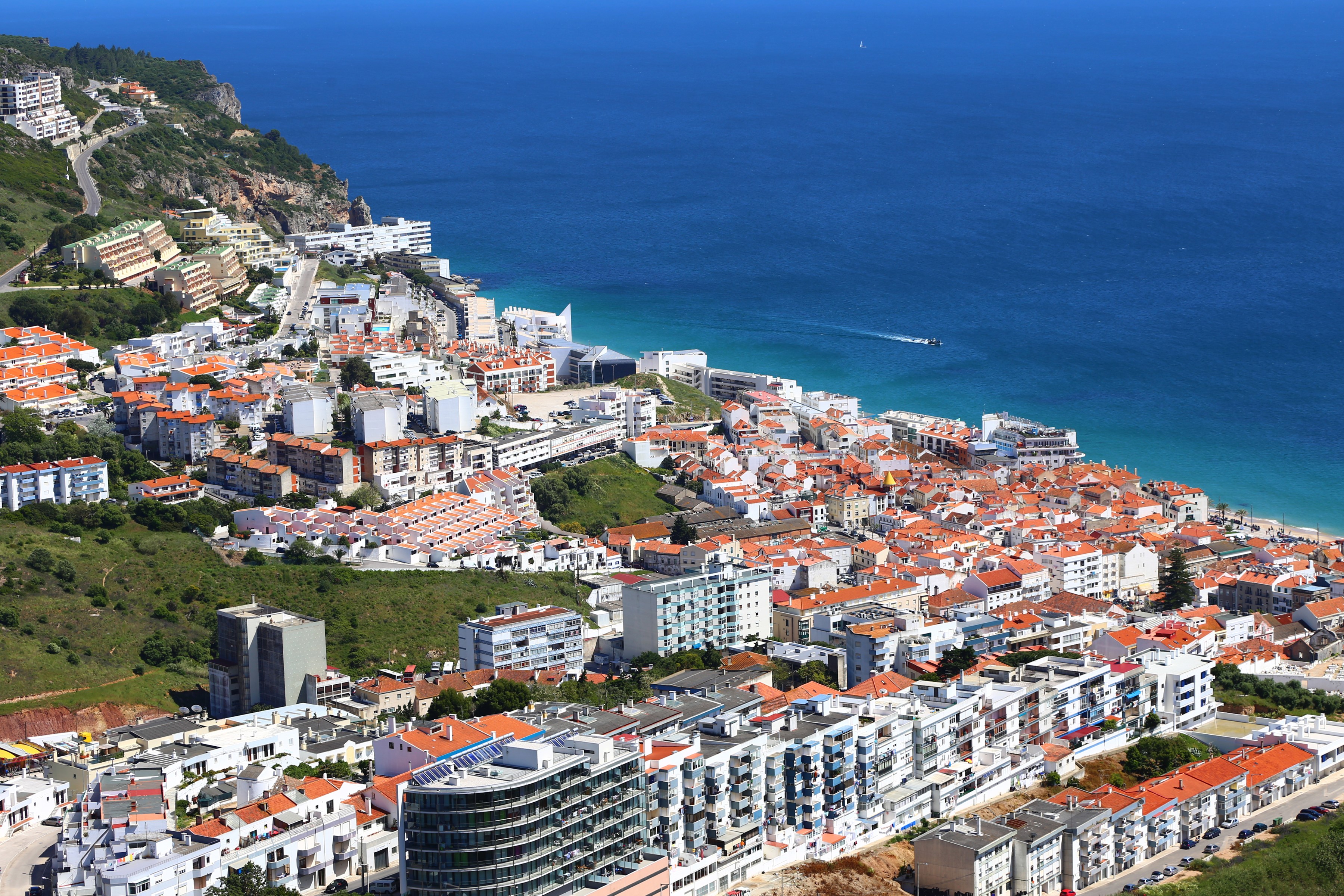Sesimbra, Portugal: Coastal Town with Red-Tiled Roofs and Blue Ocean HD Wallpaper