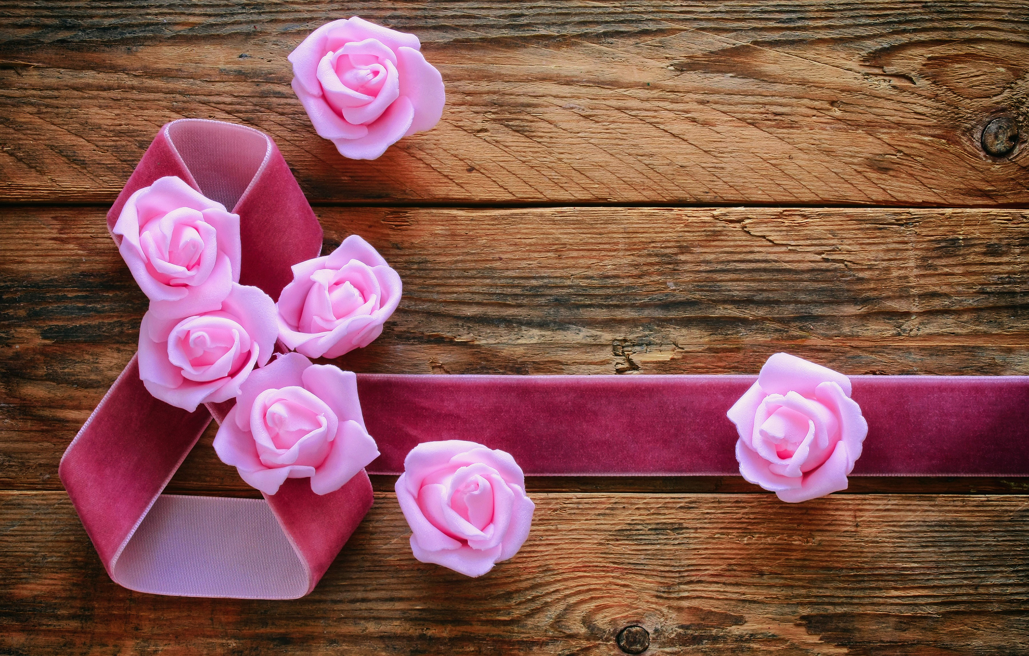 Pink ribbon and roses on wooden background HD Wallpaper