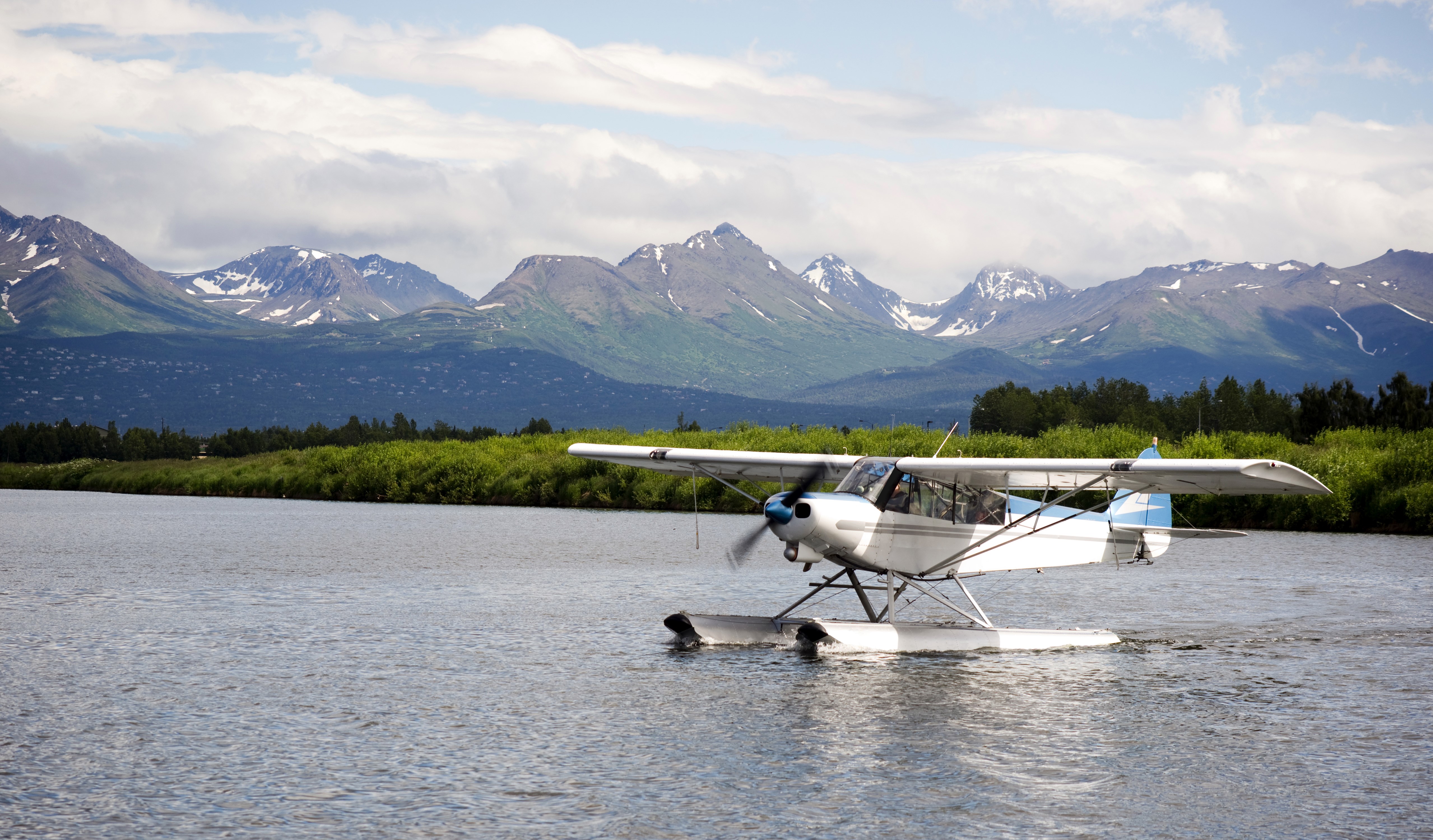 Seaplane on a lake with mountains HD Wallpaper