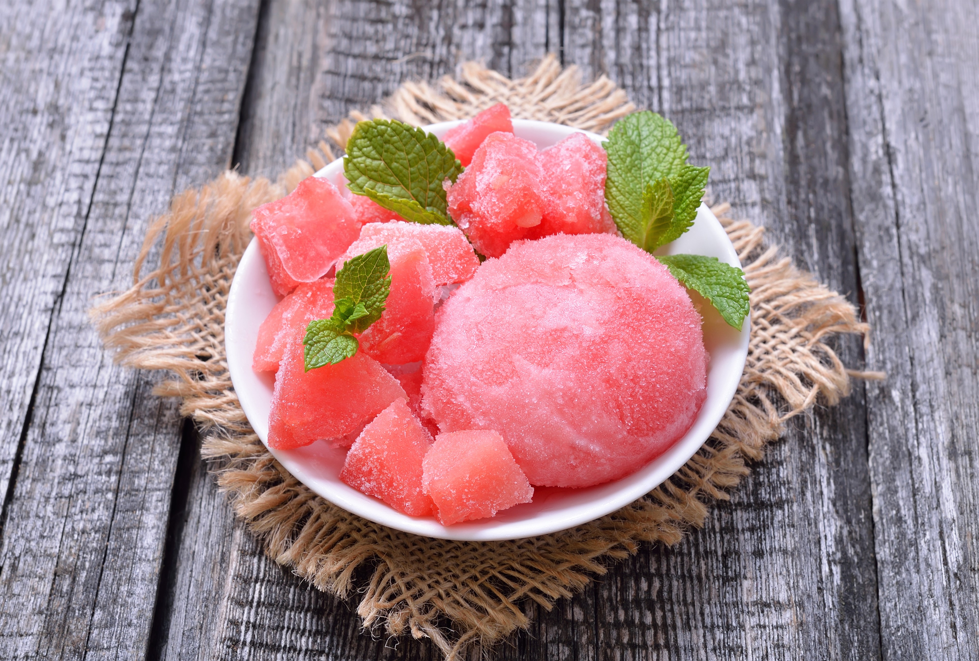 Frozen watermelon cubes and scoop with mint leaves HD Wallpaper