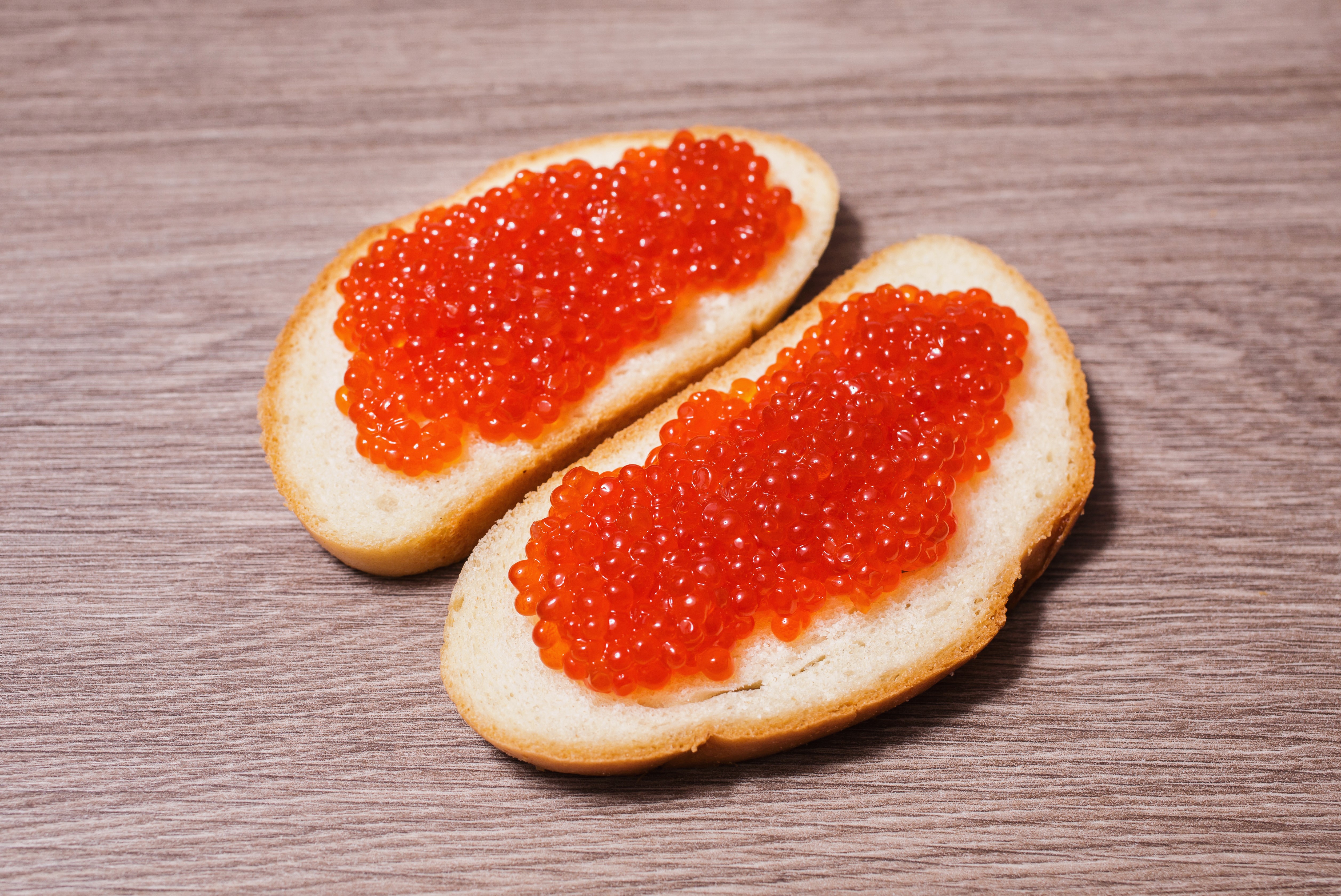 Two slices of bread with red caviar HD Wallpaper