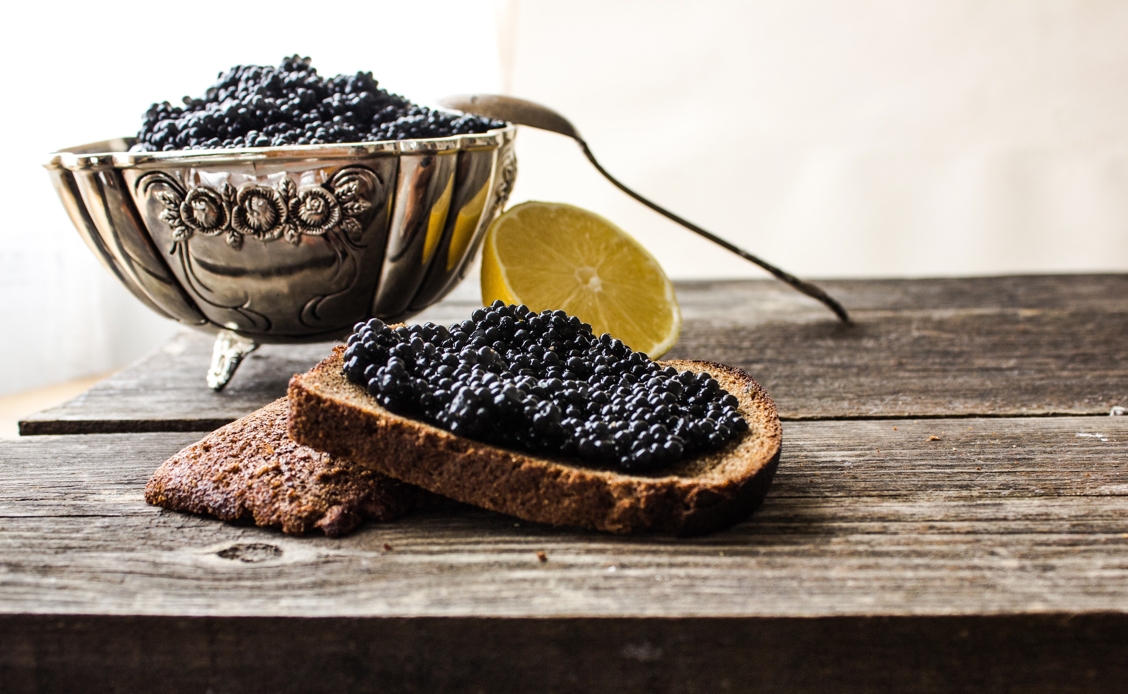 4K Caviar on Bread with Lemon and Spoon HD Wallpaper