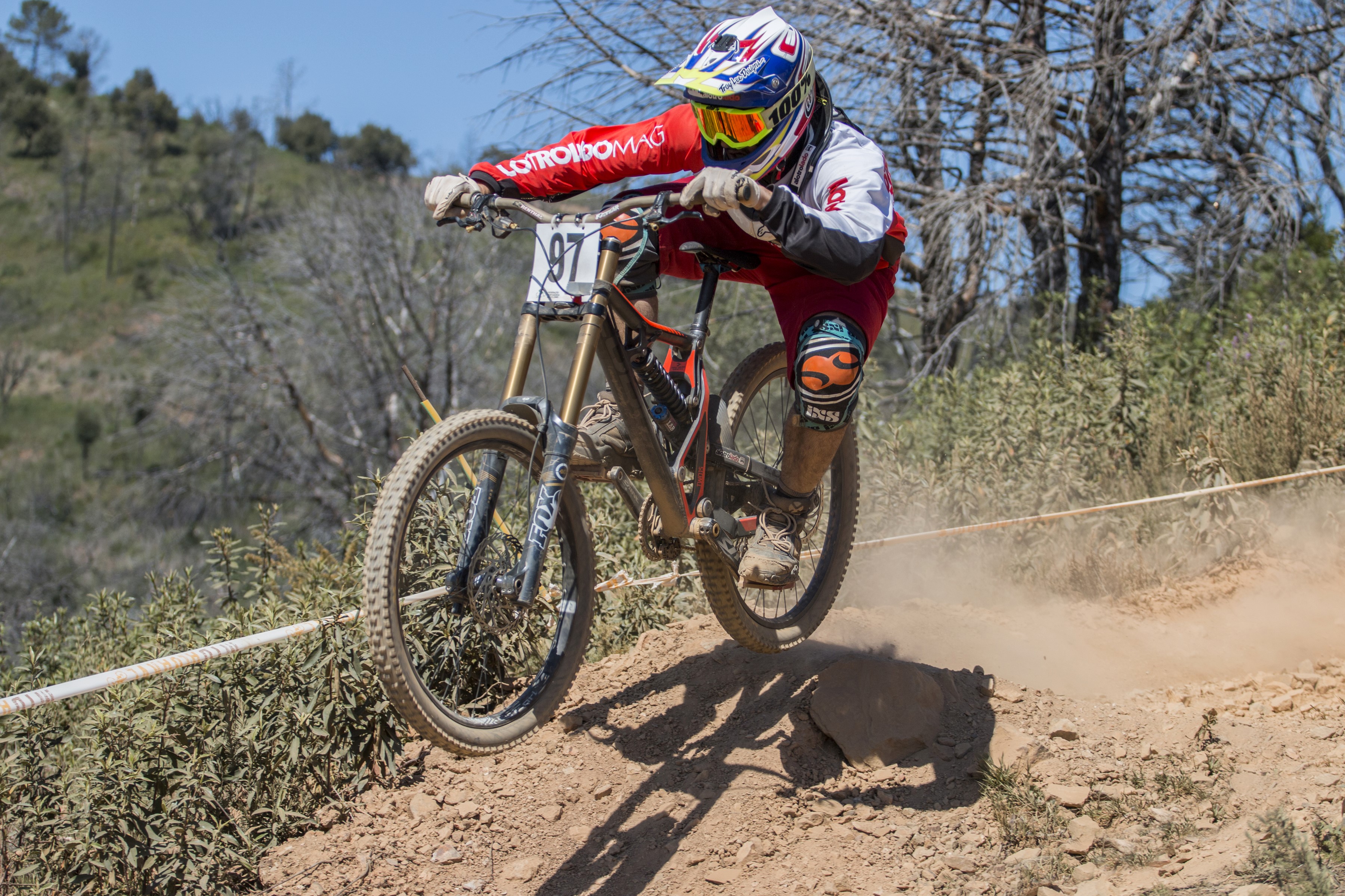 Downhill mountain biker in mid-air HD Wallpaper