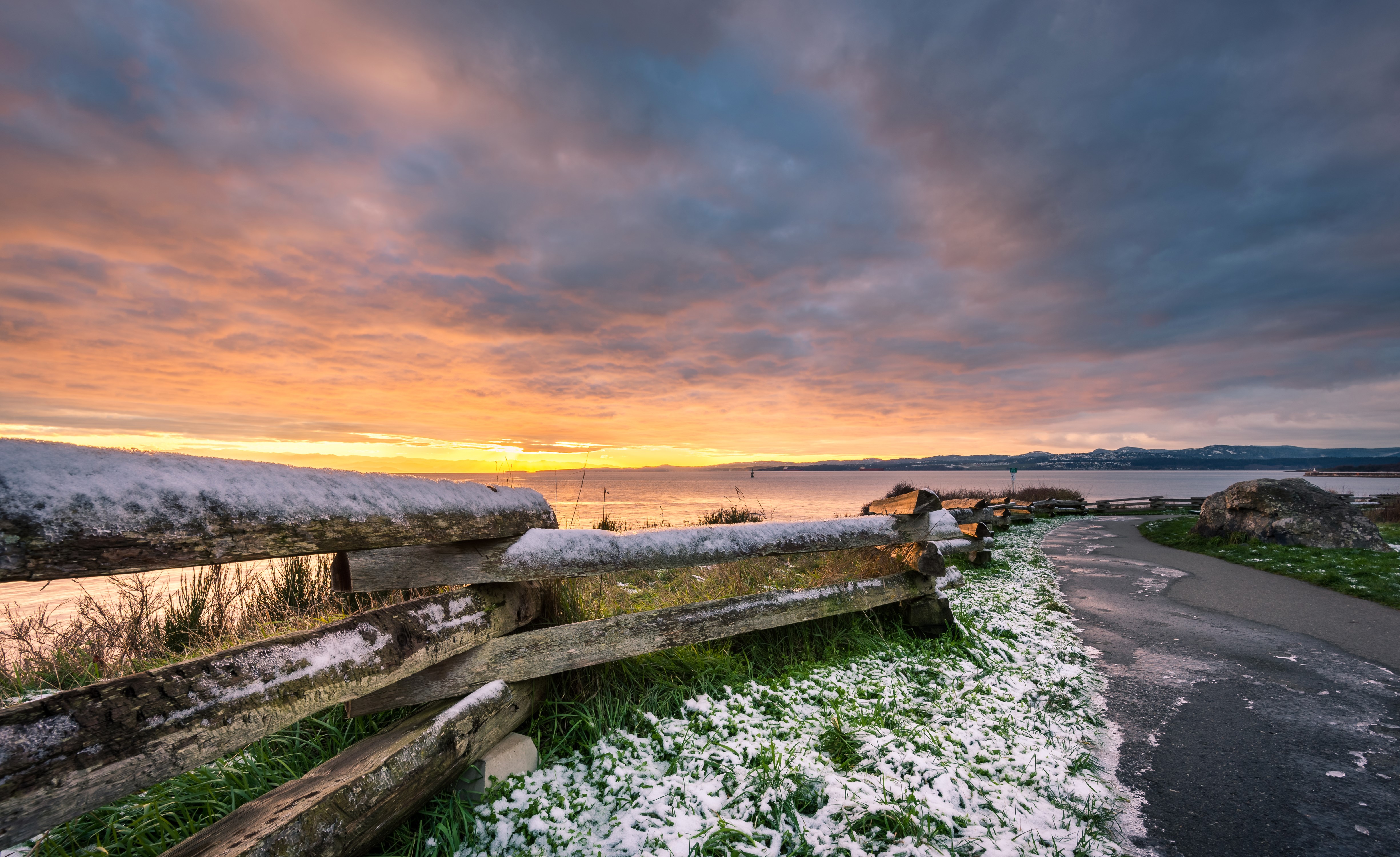 Snowy fence along the coast at sunrise in British Columbia, Canada HD Wallpaper