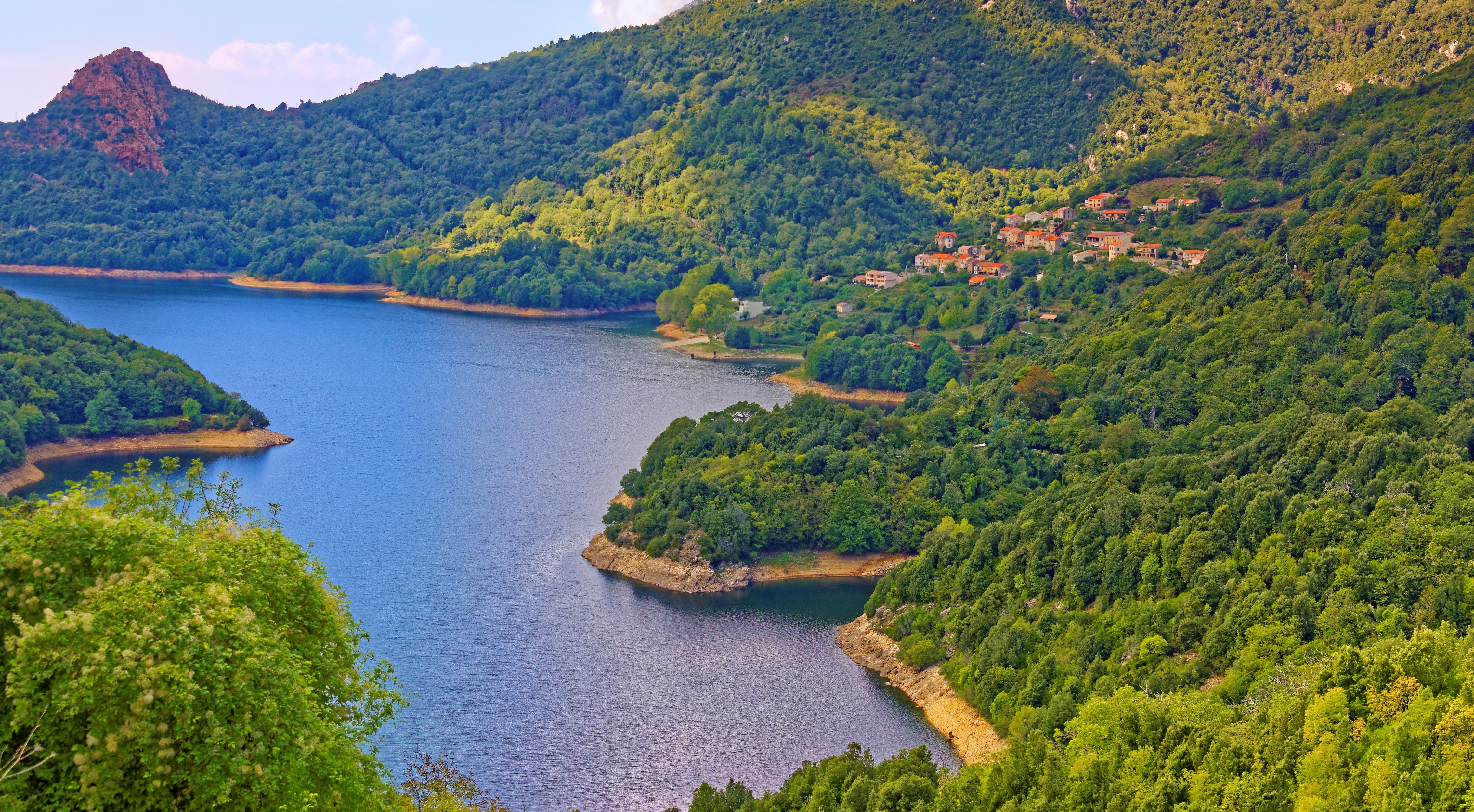 Mountains and Forest Surrounding a Bay in Corsica, France HD Wallpaper