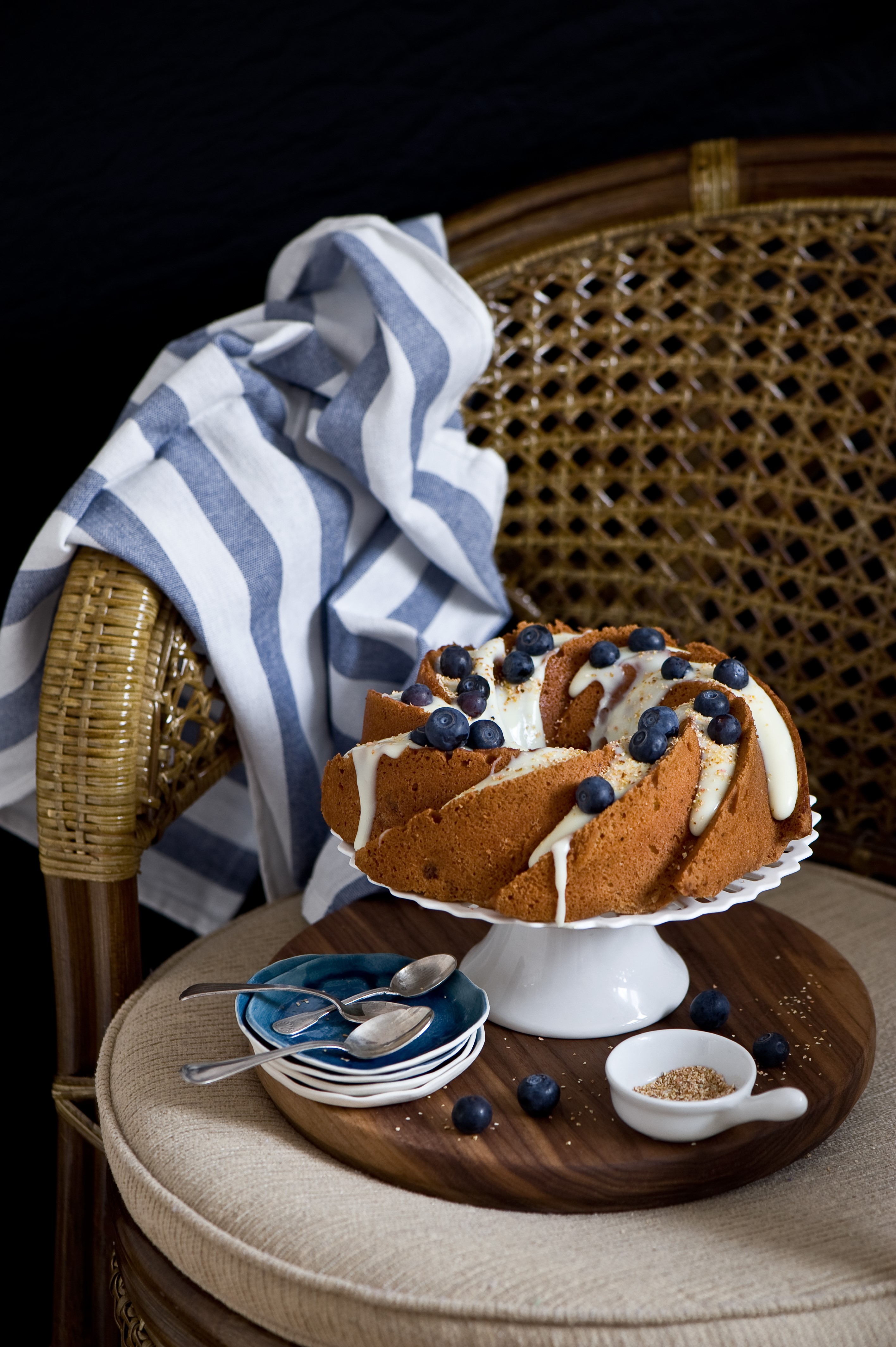 Bundt cake with blueberries and icing on a cake stand HD Phone Wallpaper