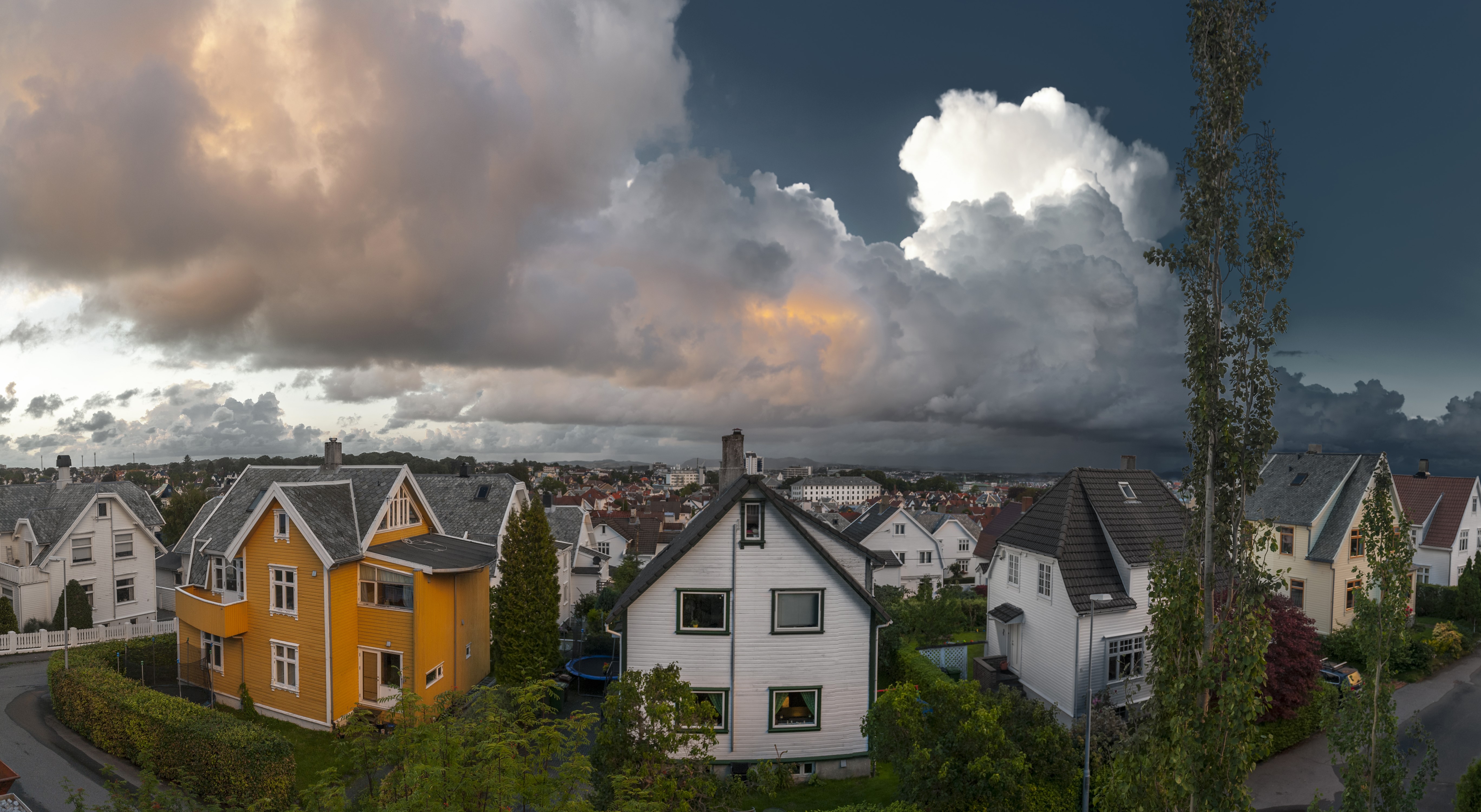 Houses and dramatic clouds in Stavanger, Rogaland, Norway HD Wallpaper
