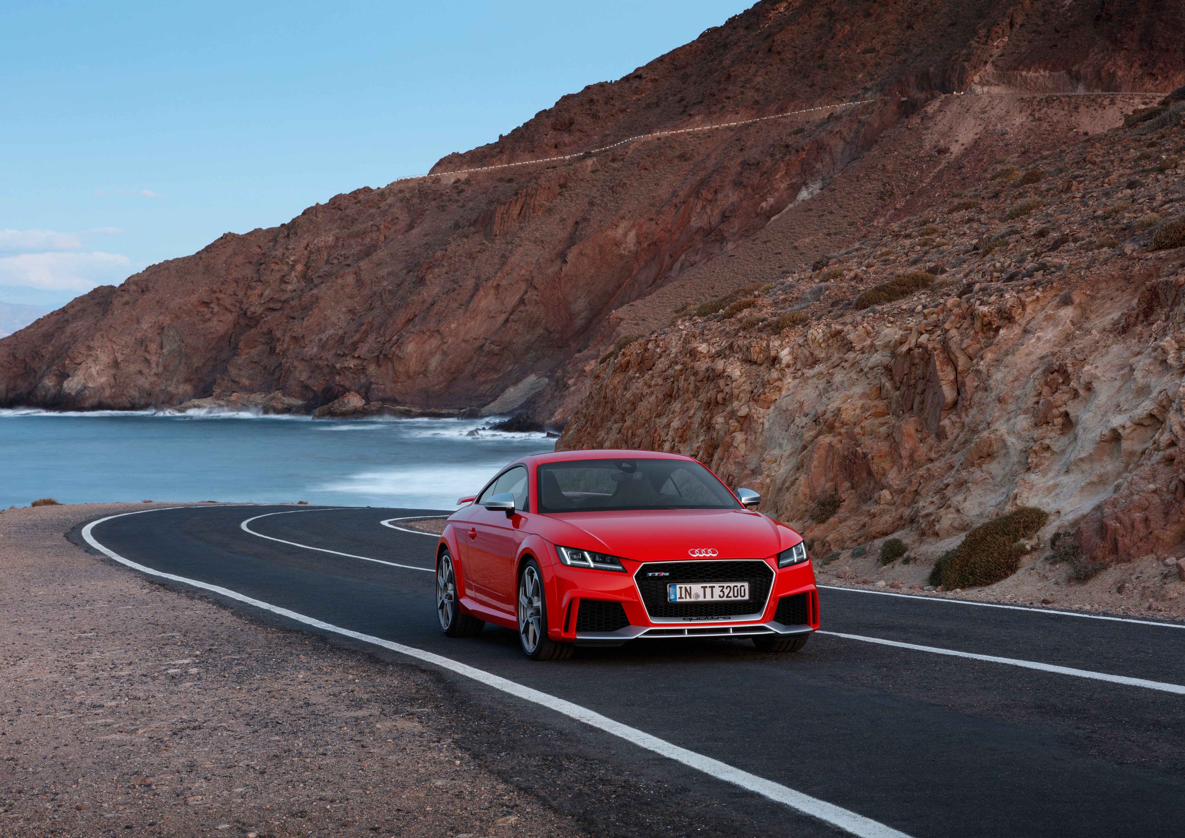 Red Audi TT RS Roadster on a Coastal Road HD Wallpaper