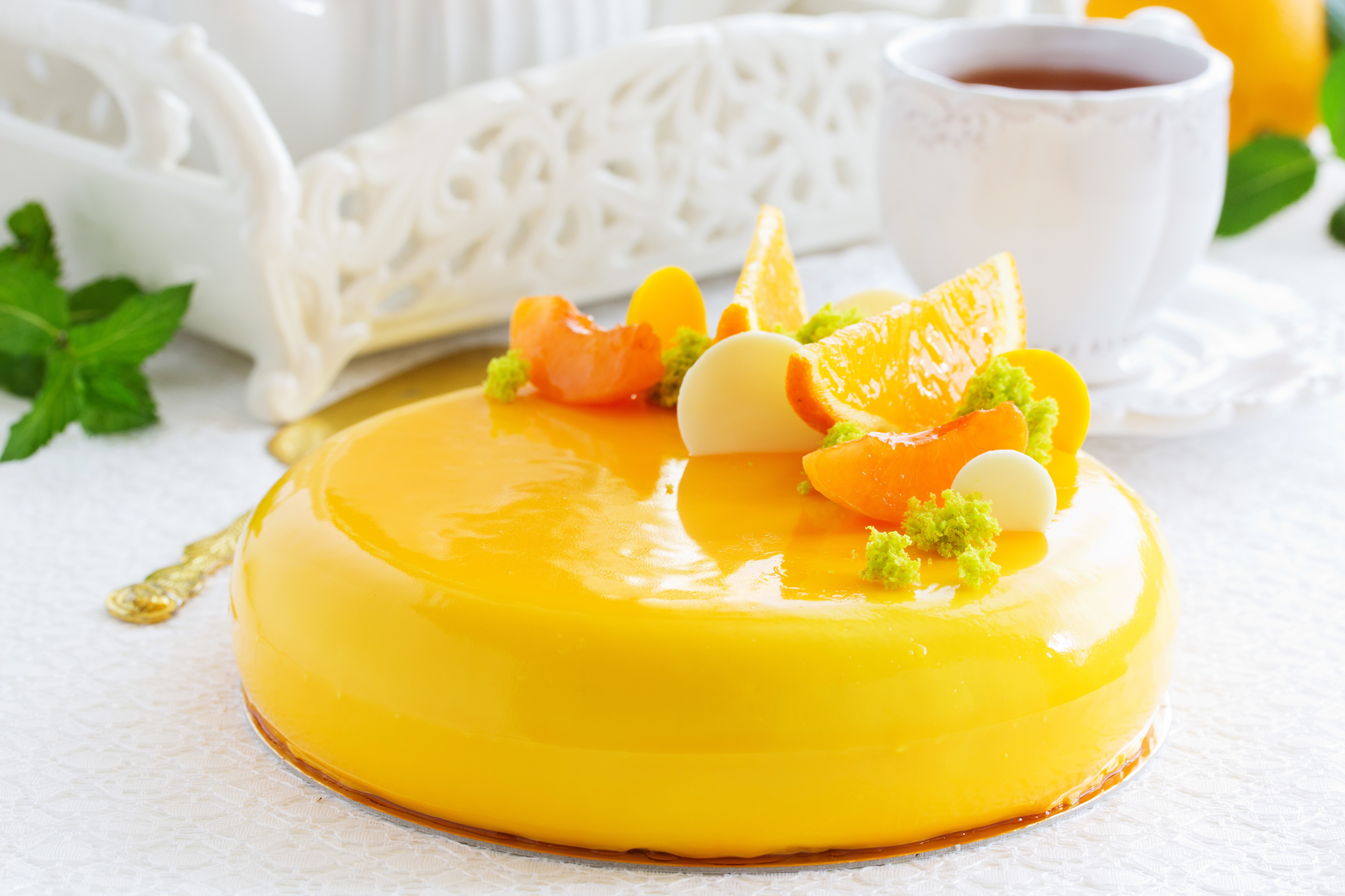Yellow mirror glaze cake with fruit and tea HD Wallpaper