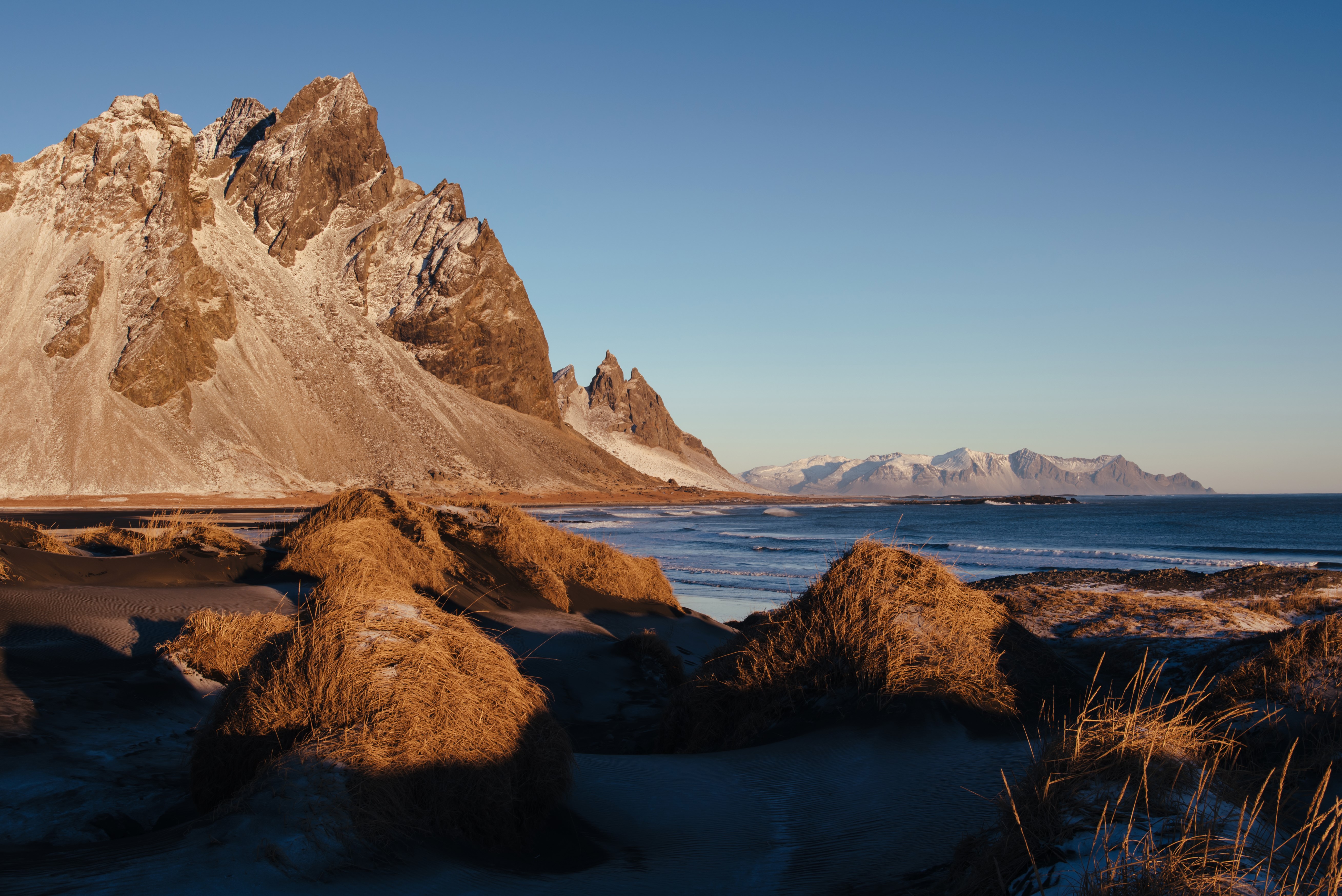 Icelandic Coastline with Jagged Mountains and Dunes HD Wallpaper