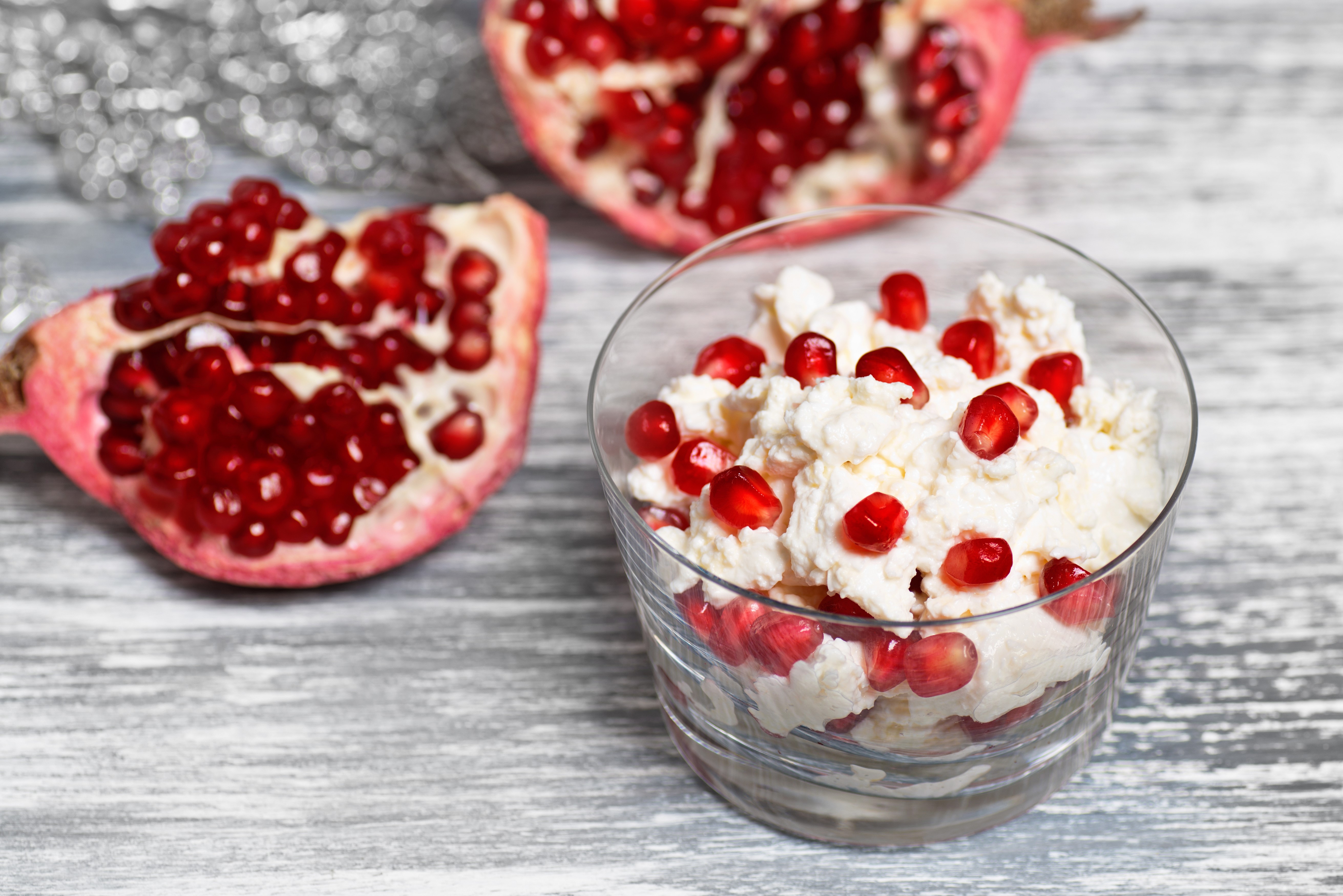 Pomegranate seeds with cottage cheese in a glass HD Wallpaper