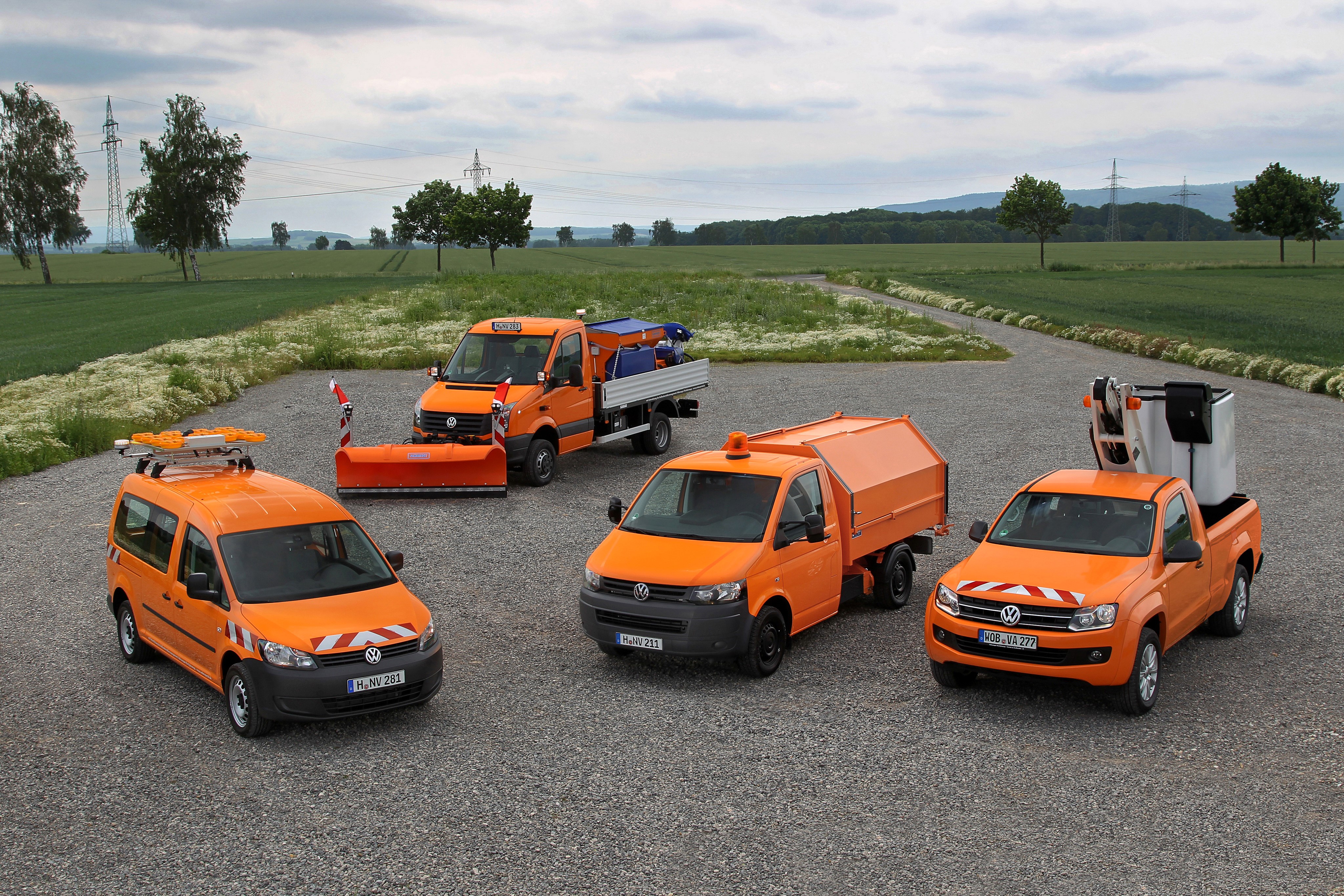 Volkswagen utility vehicles with snow plow and lift HD Wallpaper