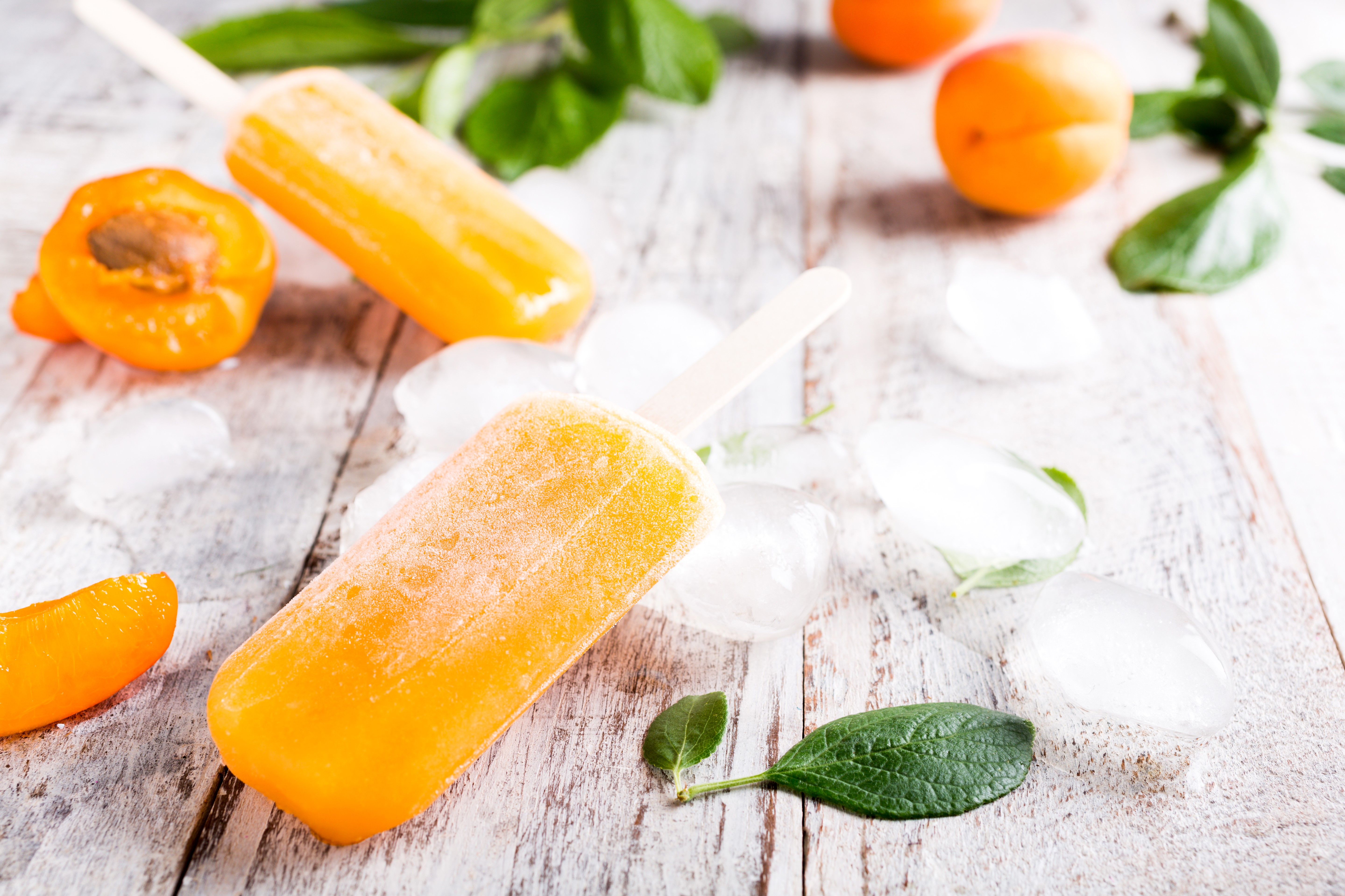 Orange popsicles with apricots and ice HD Wallpaper