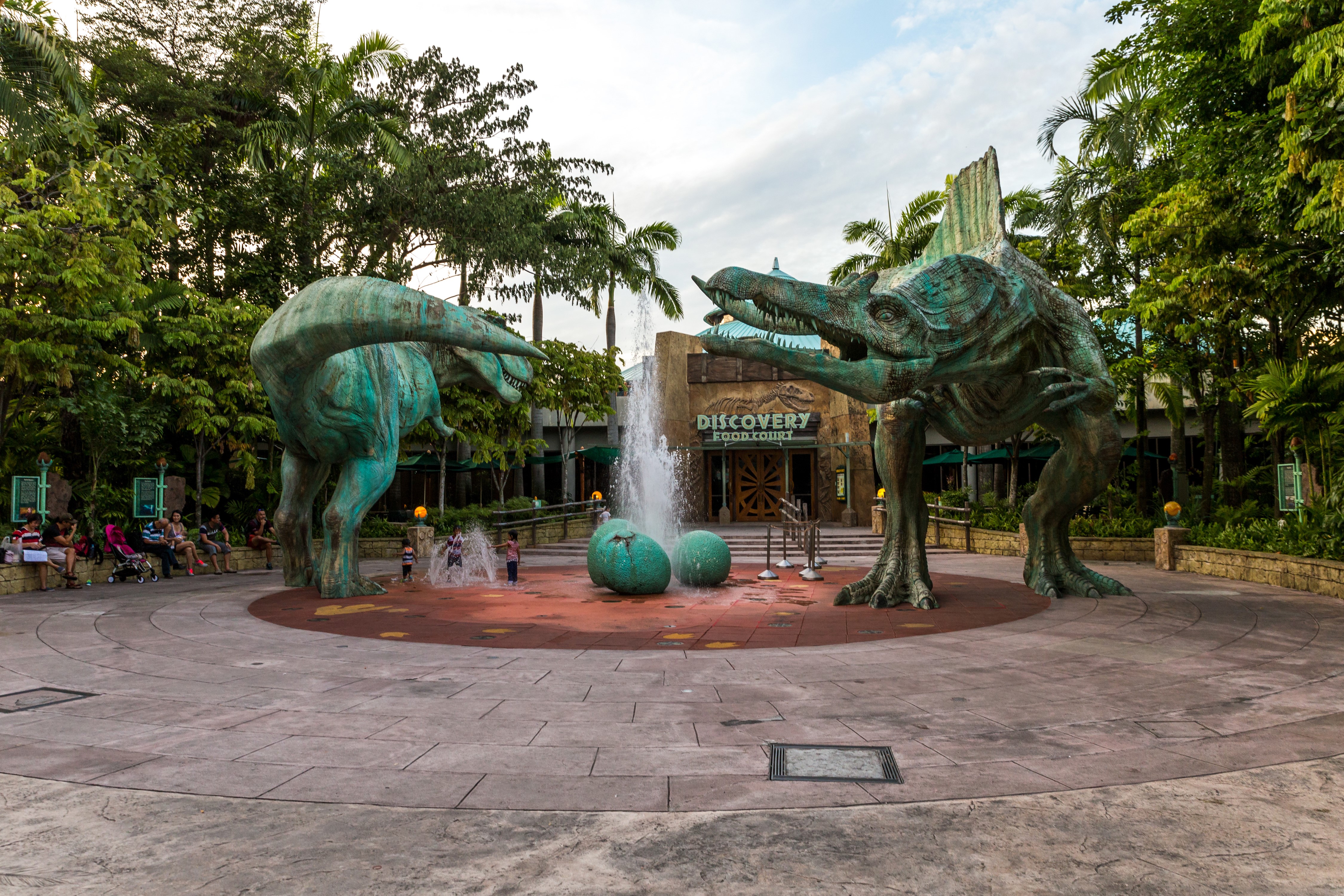 Dinosaurs and fountain at Discovery Food Court, Singapore HD Wallpaper