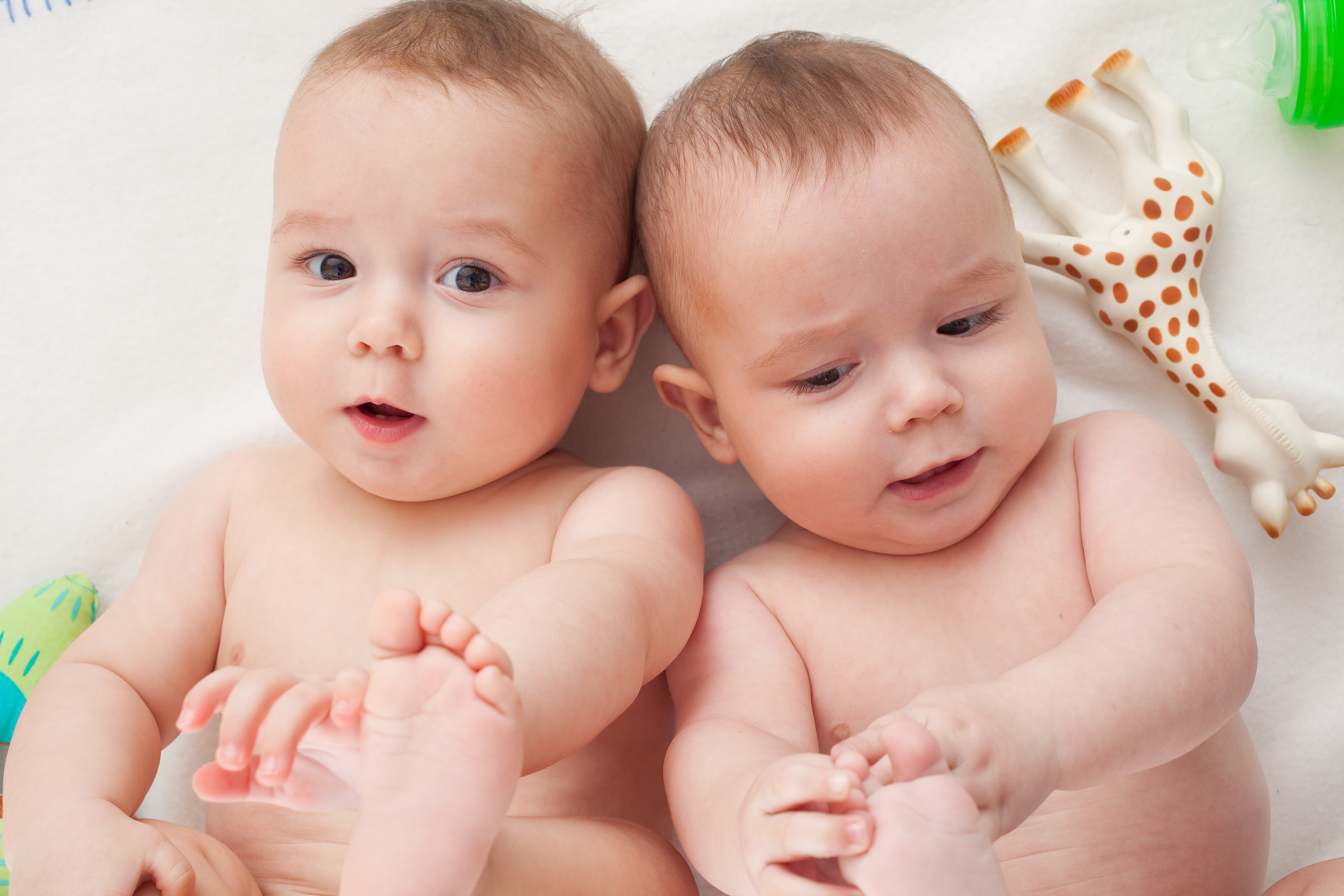 Two Infants with Toys HD Wallpaper