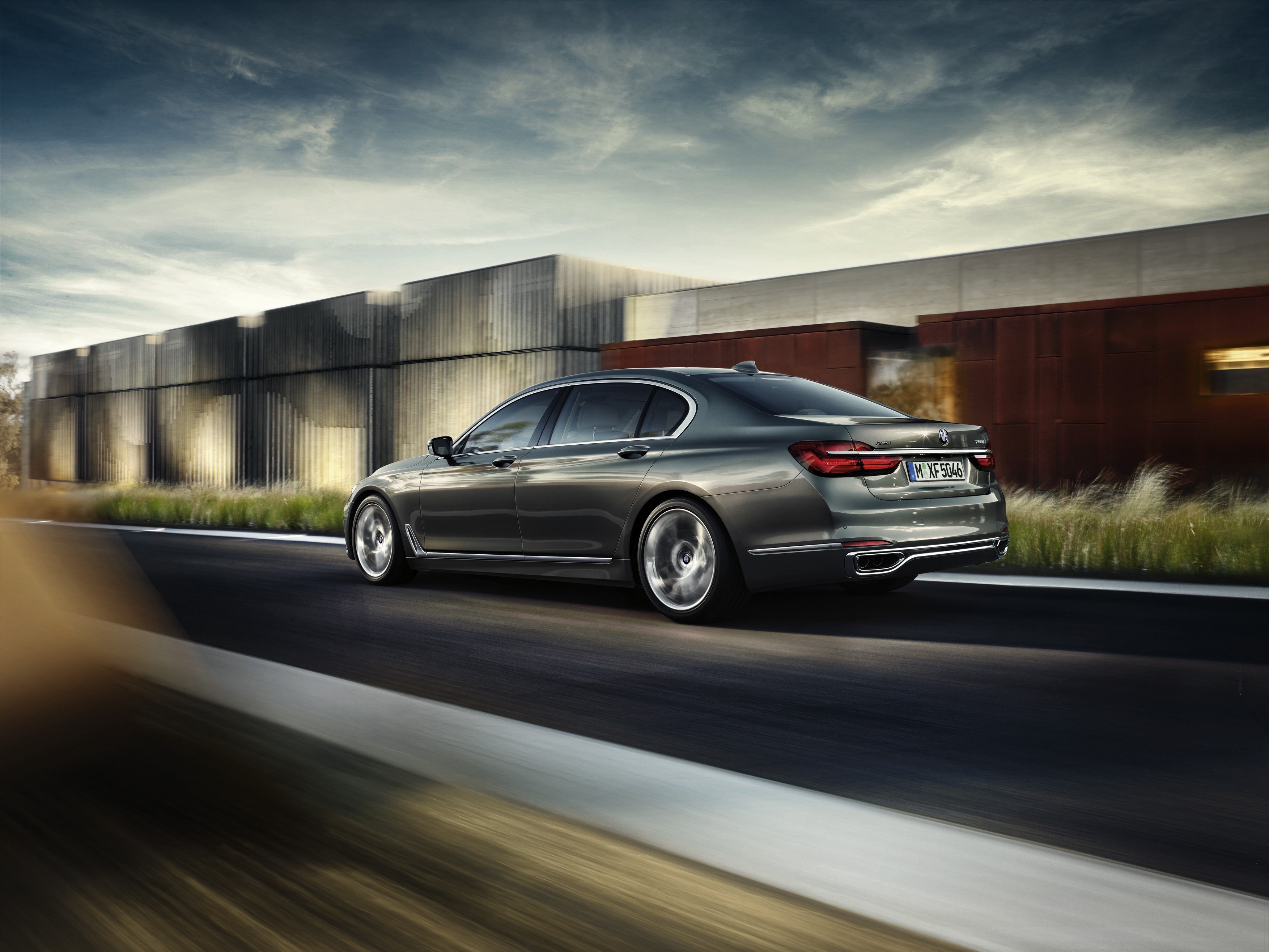 BMW 750Li G12 driving on a road HD Wallpaper