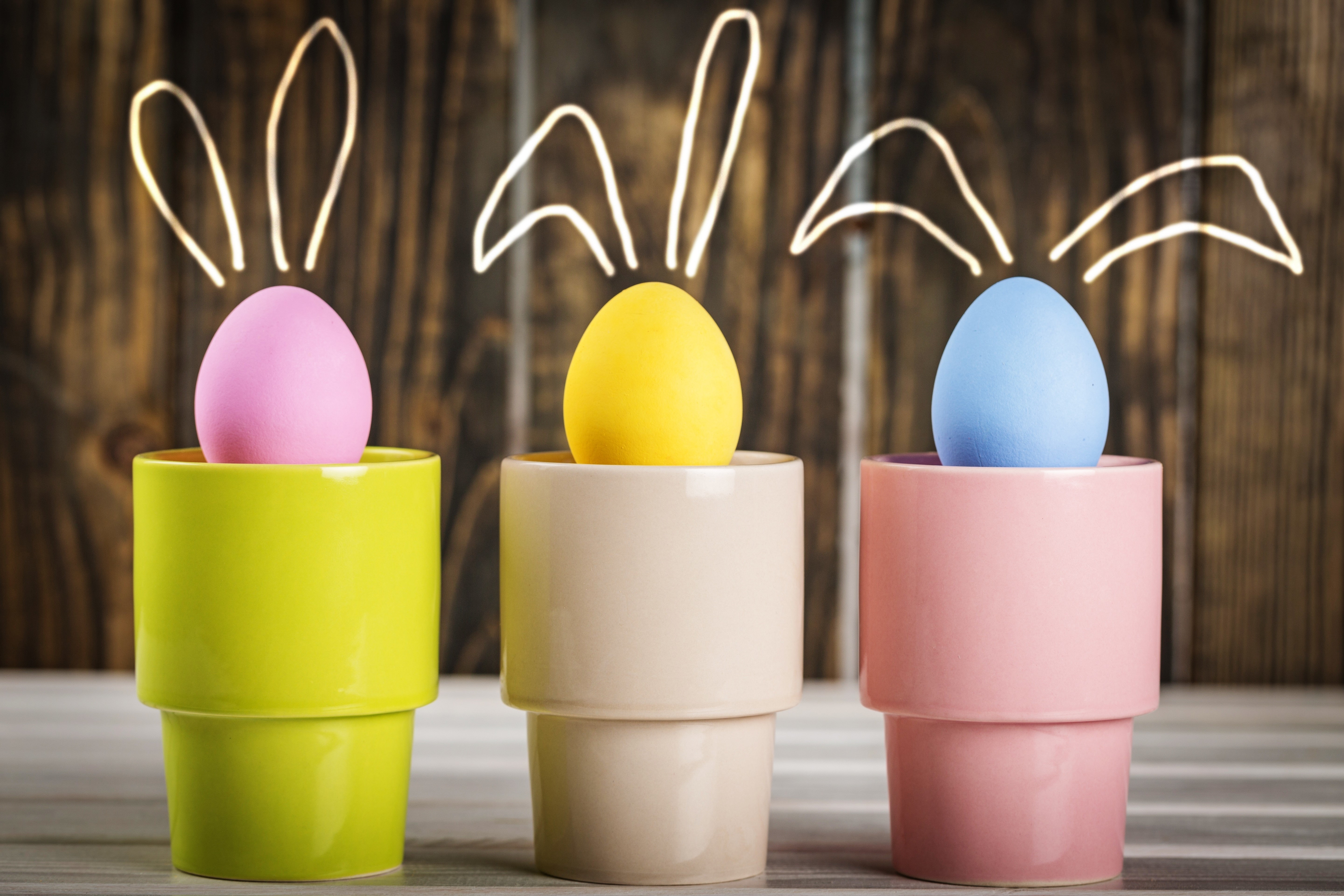 Easter Eggs with Bunny Ears on Wooden Background HD Wallpaper