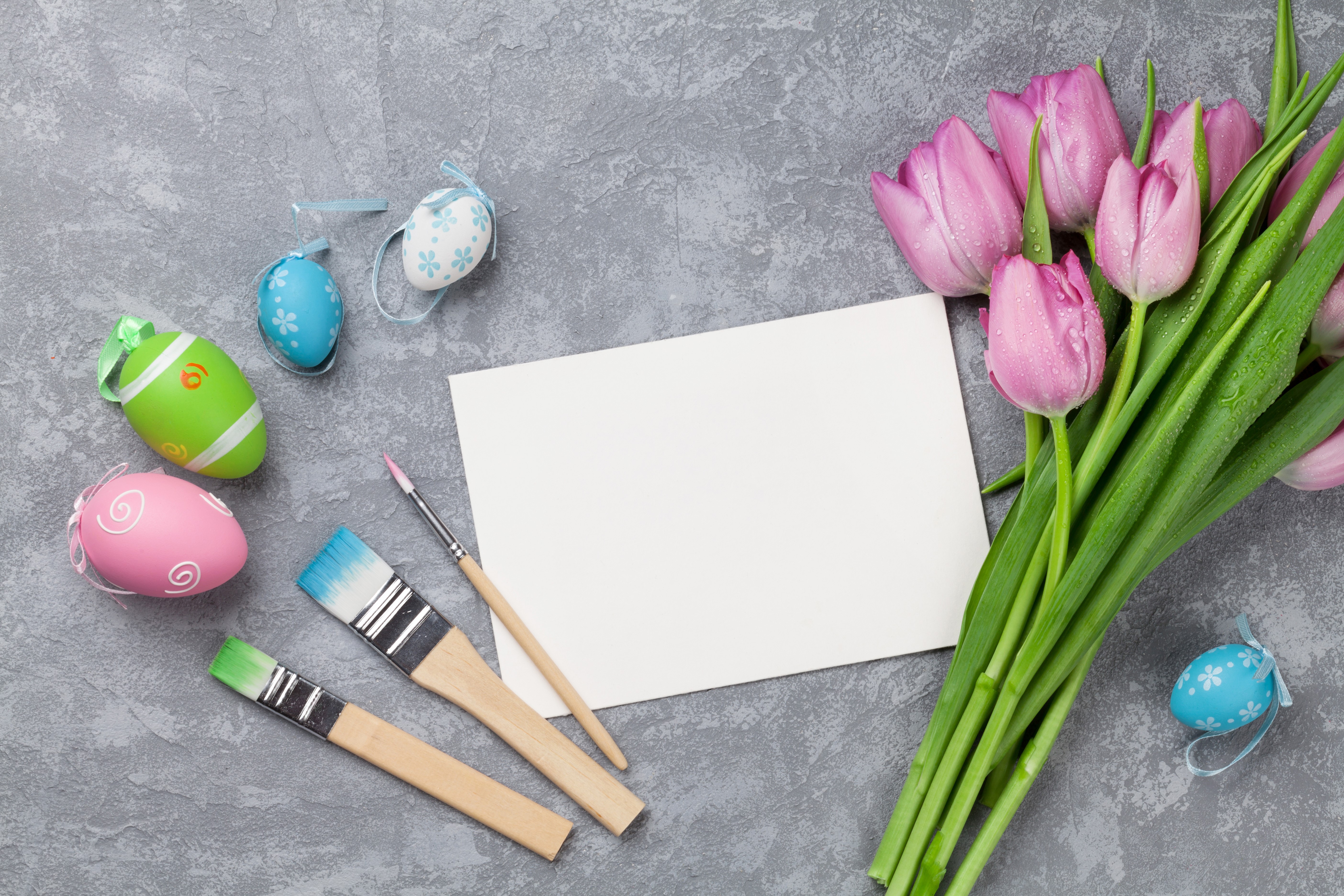 Easter Eggs, Tulips, and Paintbrushes on a Gray Surface HD Wallpaper