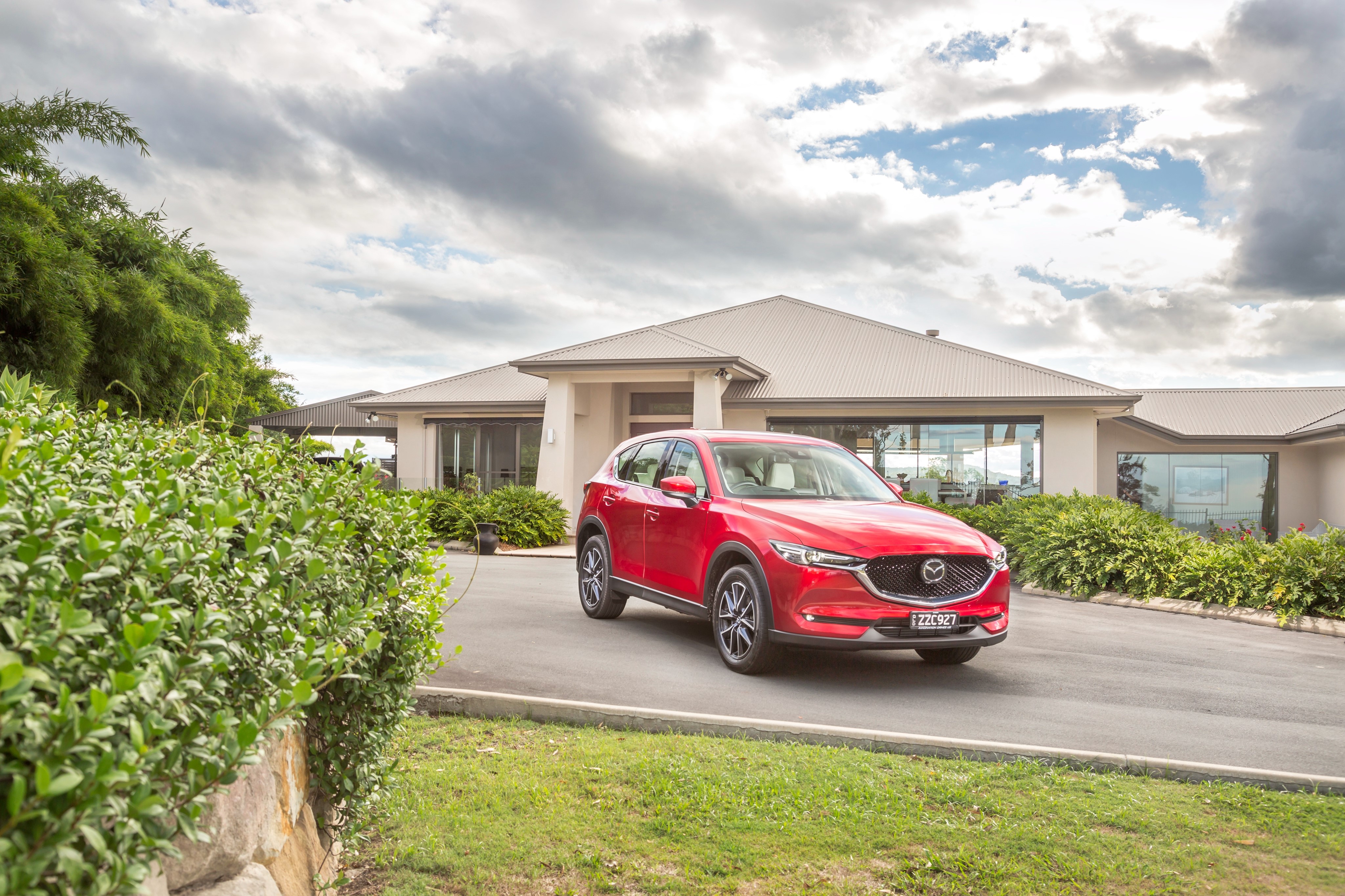 Red 2017 Mazda CX-5 Akera parked in front of a house HD Wallpaper