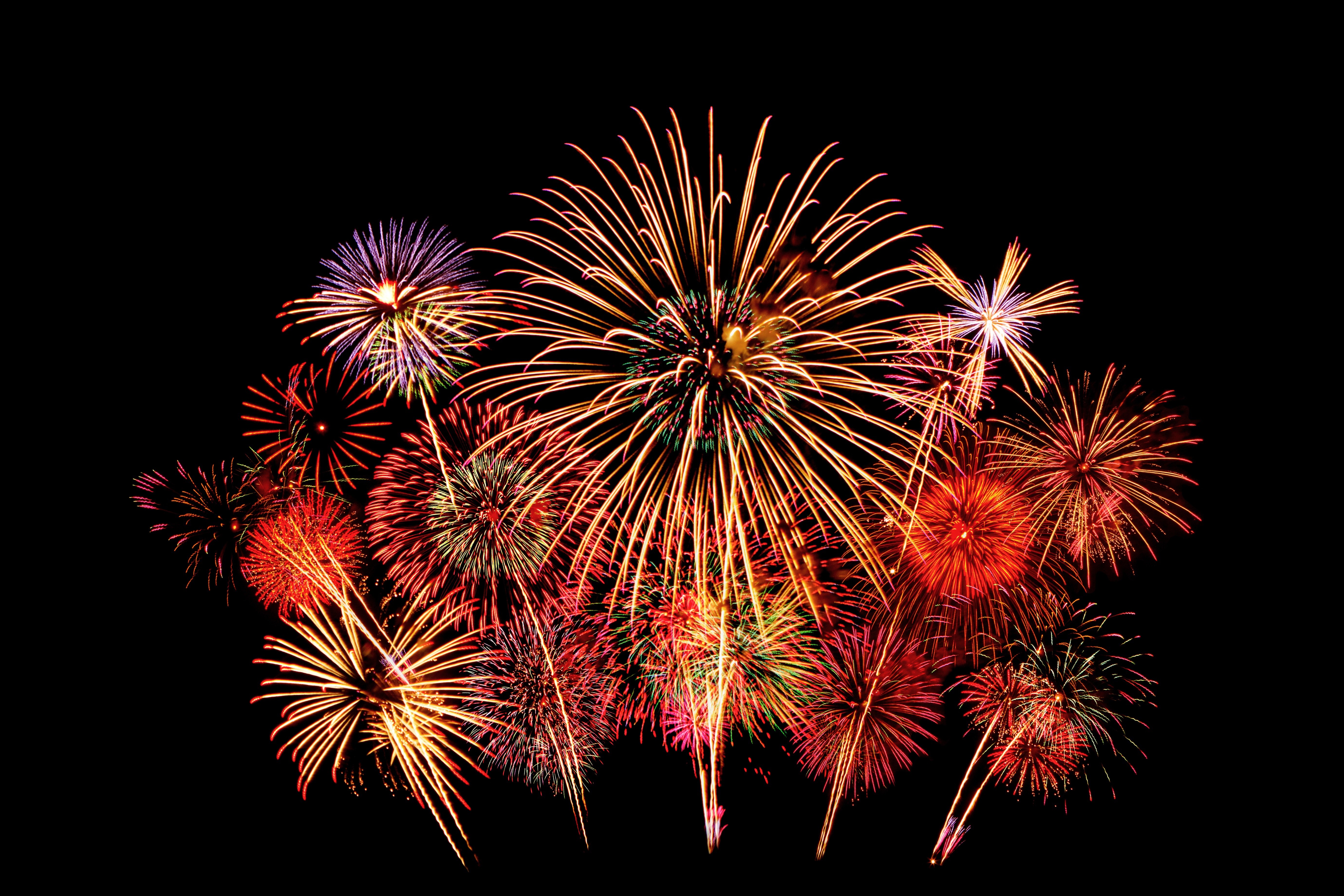 Fireworks exploding in the night sky HD Wallpaper