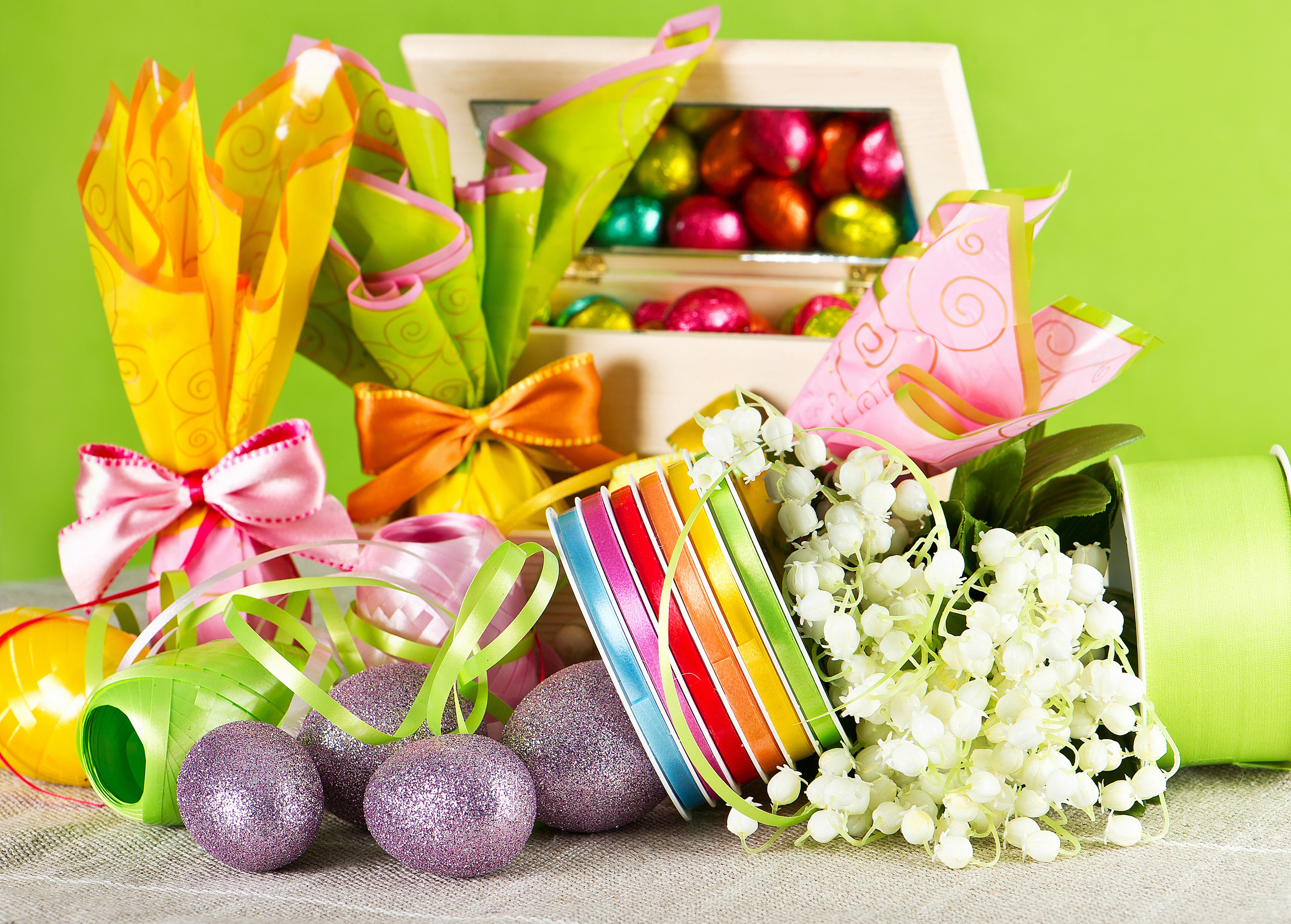 Easter Decorations with Chocolate Eggs and Lily of the Valley HD Wallpaper
