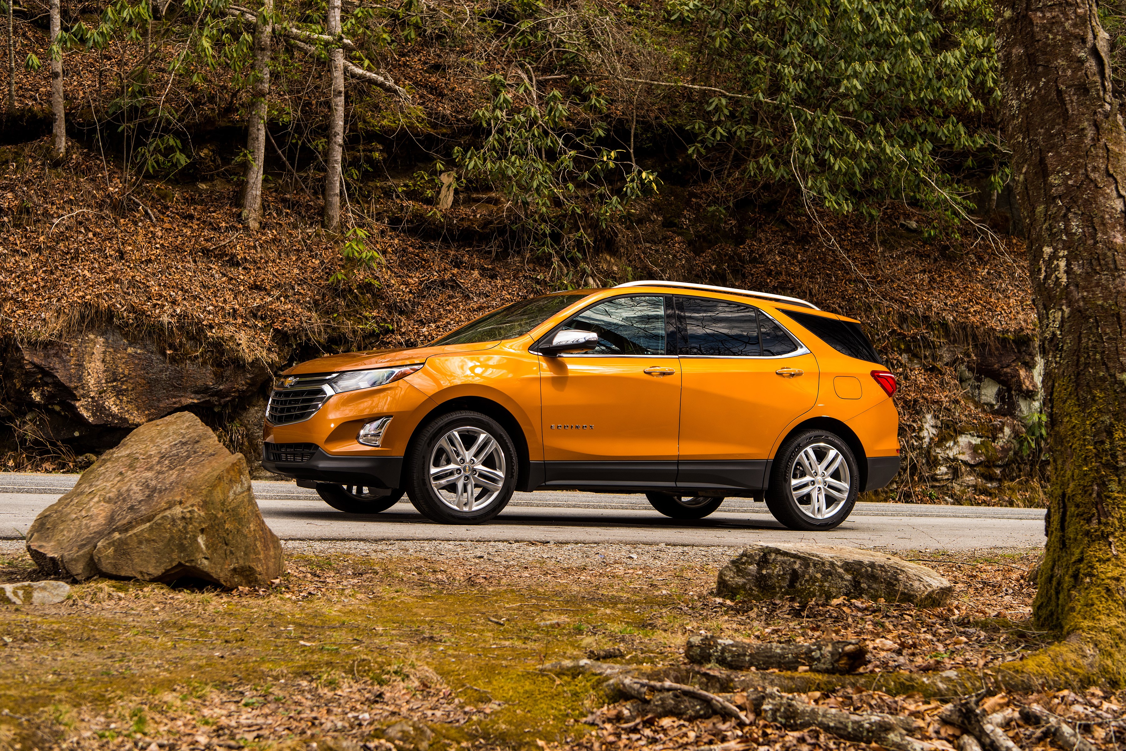 Orange 2018 Chevrolet Equinox parked on a road HD Wallpaper