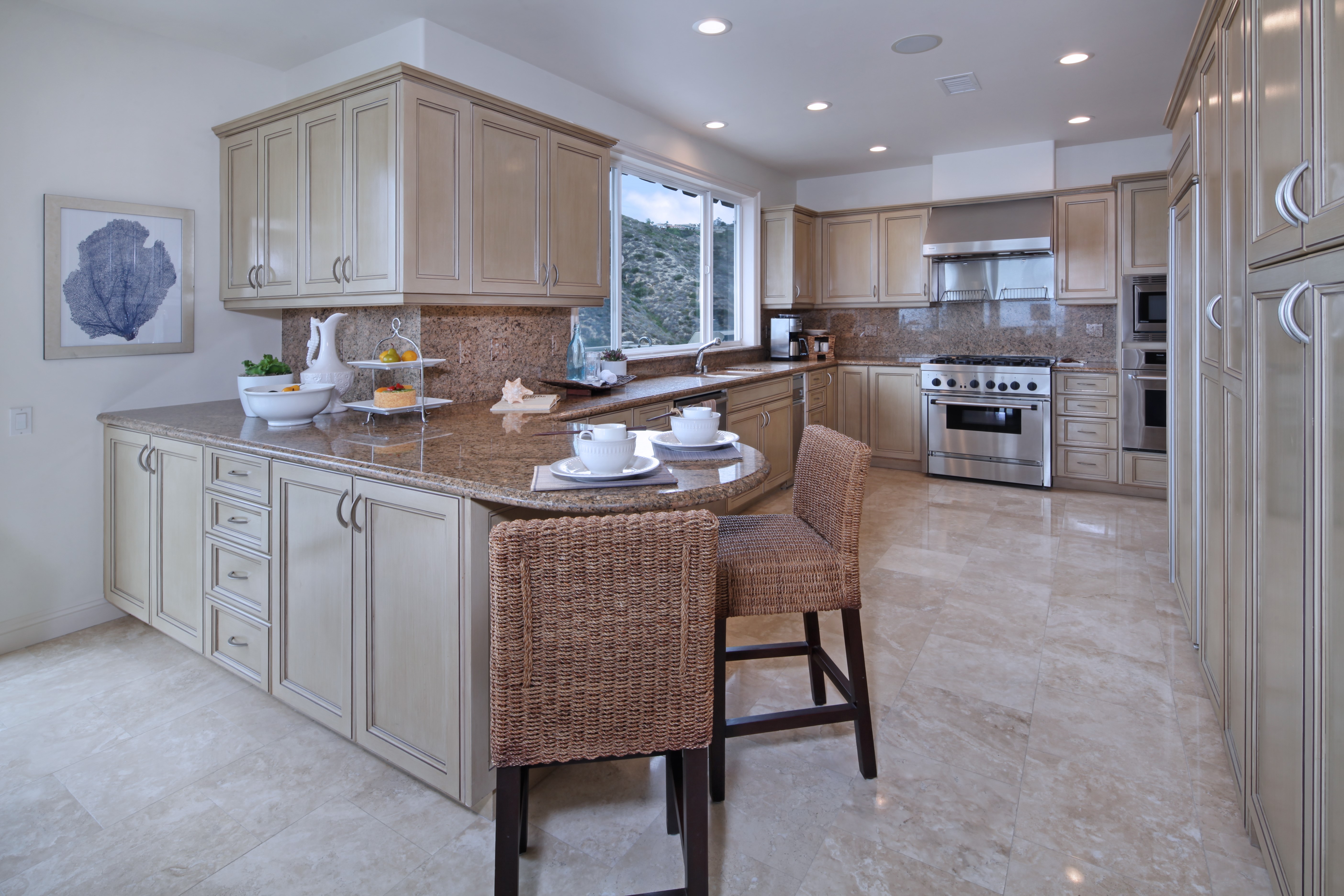 Kitchen with light wood cabinets and granite countertops HD Wallpaper
