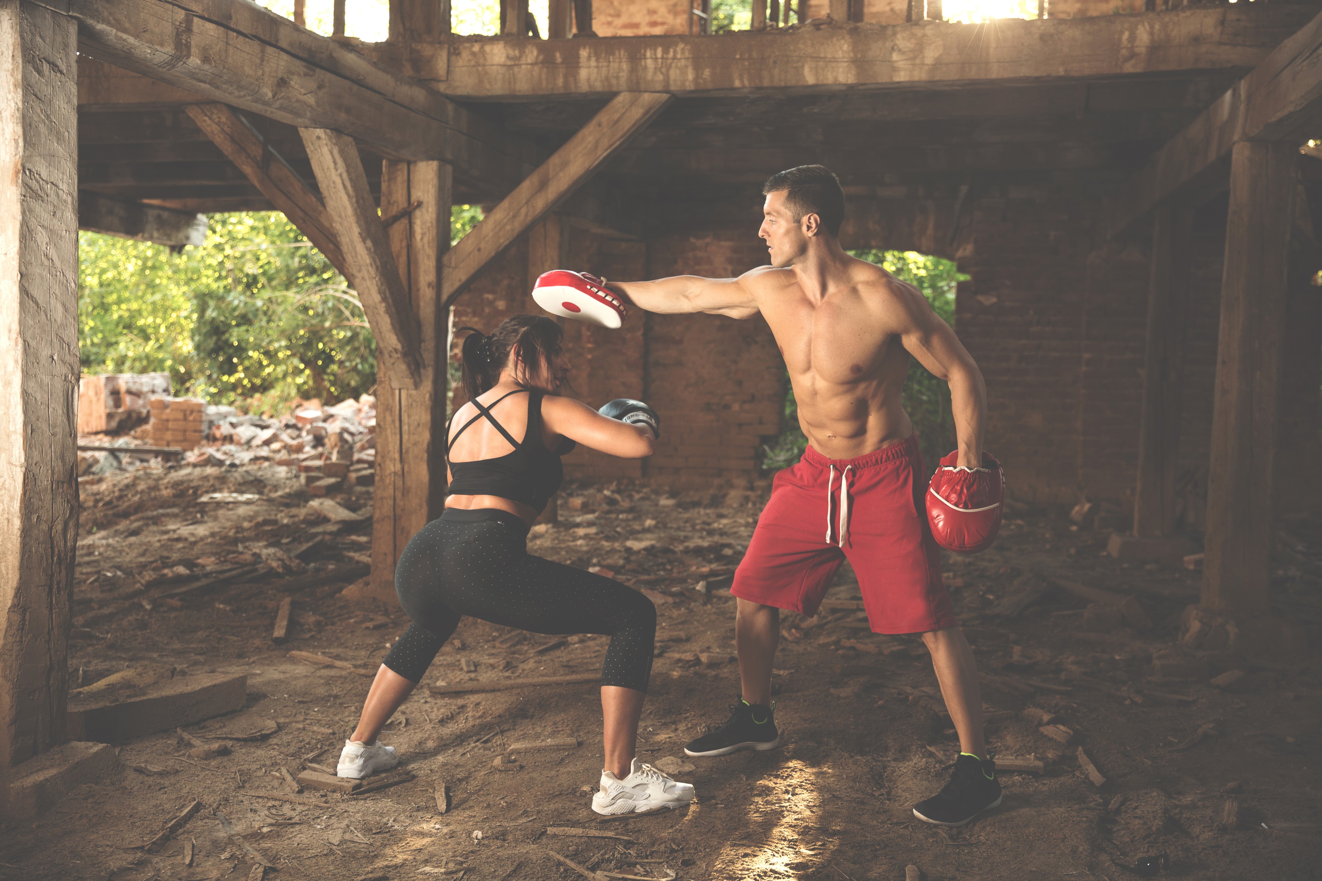 Man and Woman Boxing Workout in Ruined Building HD Wallpaper