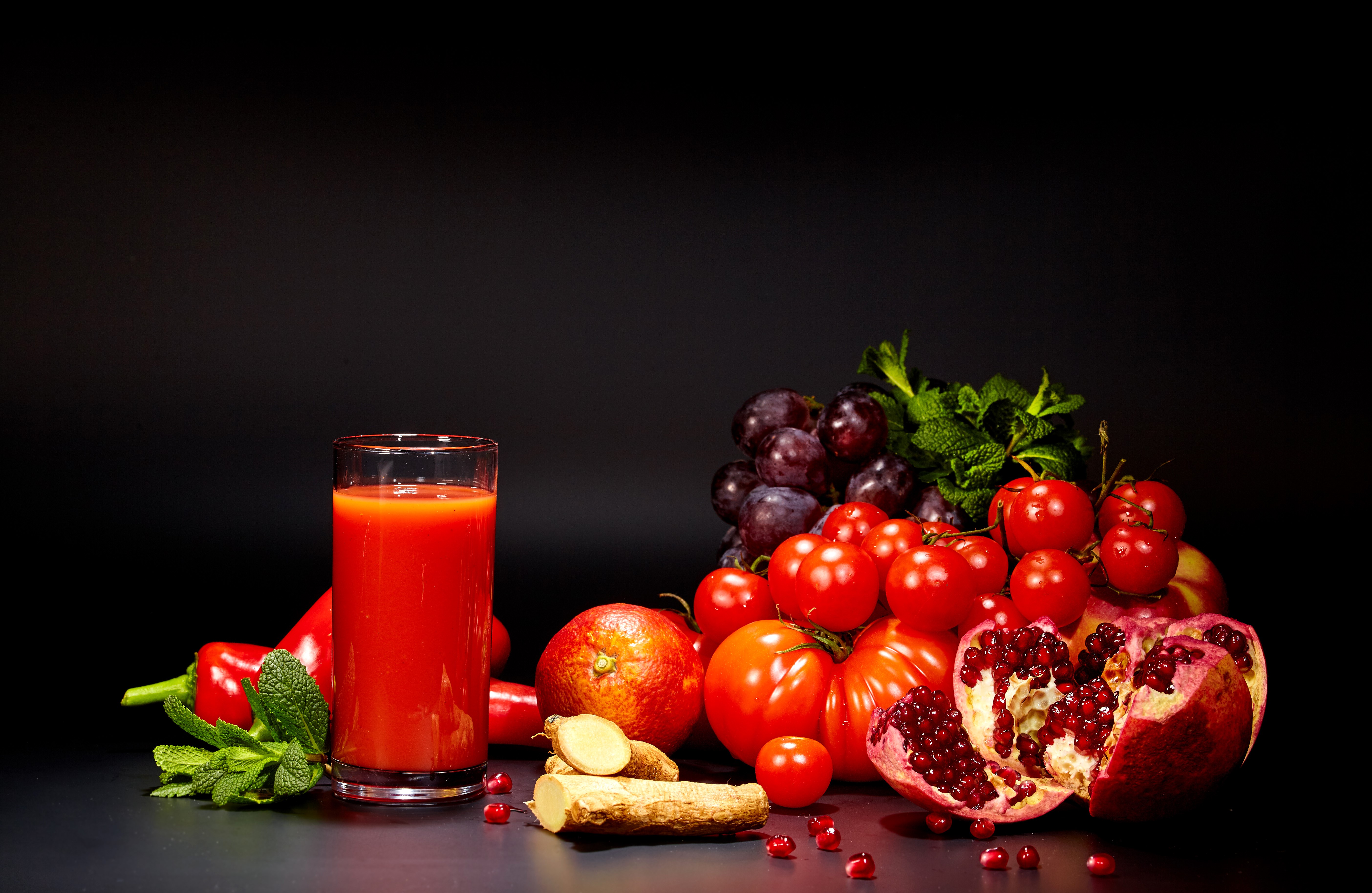 Tomatoes, Pomegranate, Grapes, Juice, and Mint on Black Background HD Wallpaper