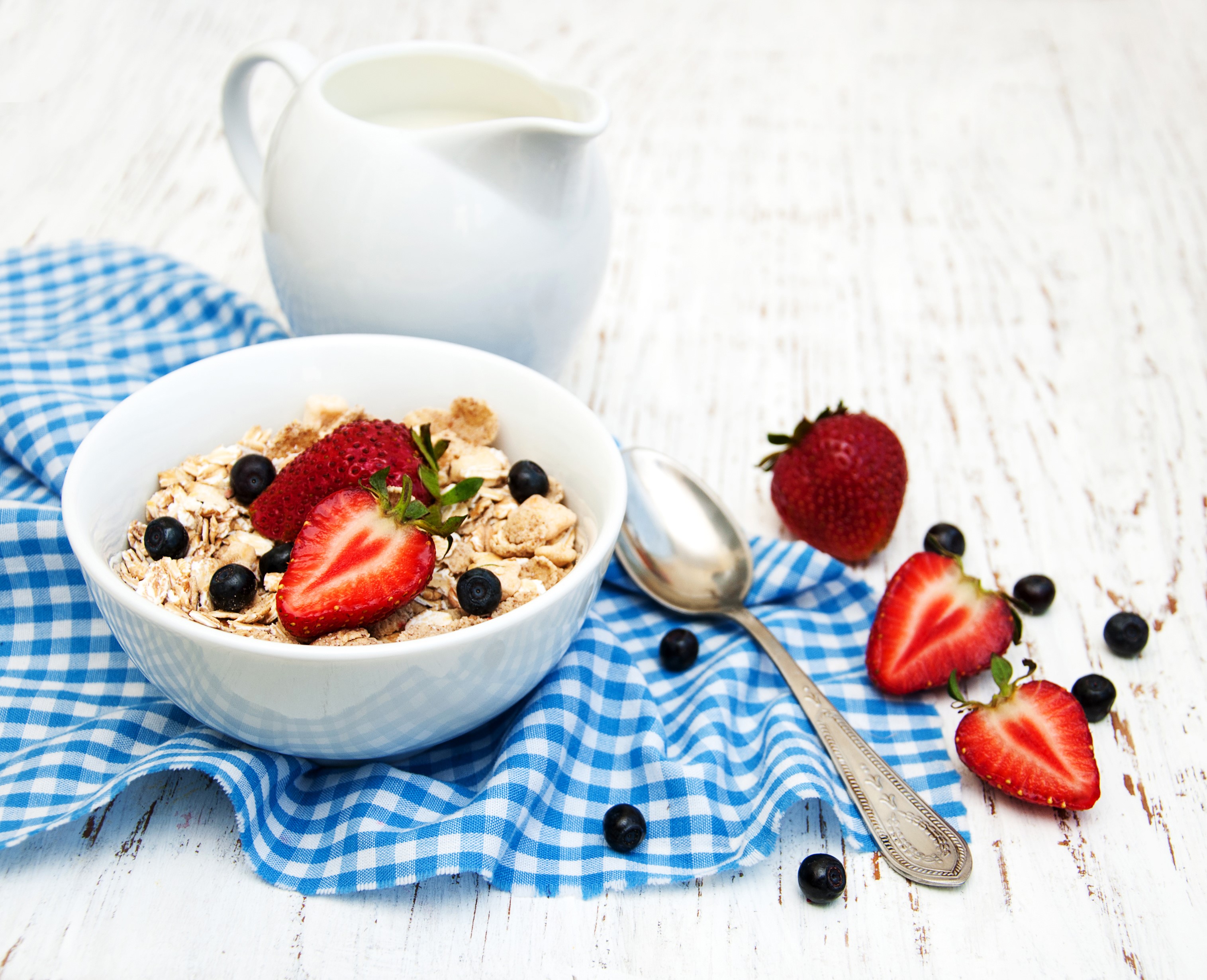 Bowl of muesli with strawberries and blueberries, jug of milk HD Wallpaper