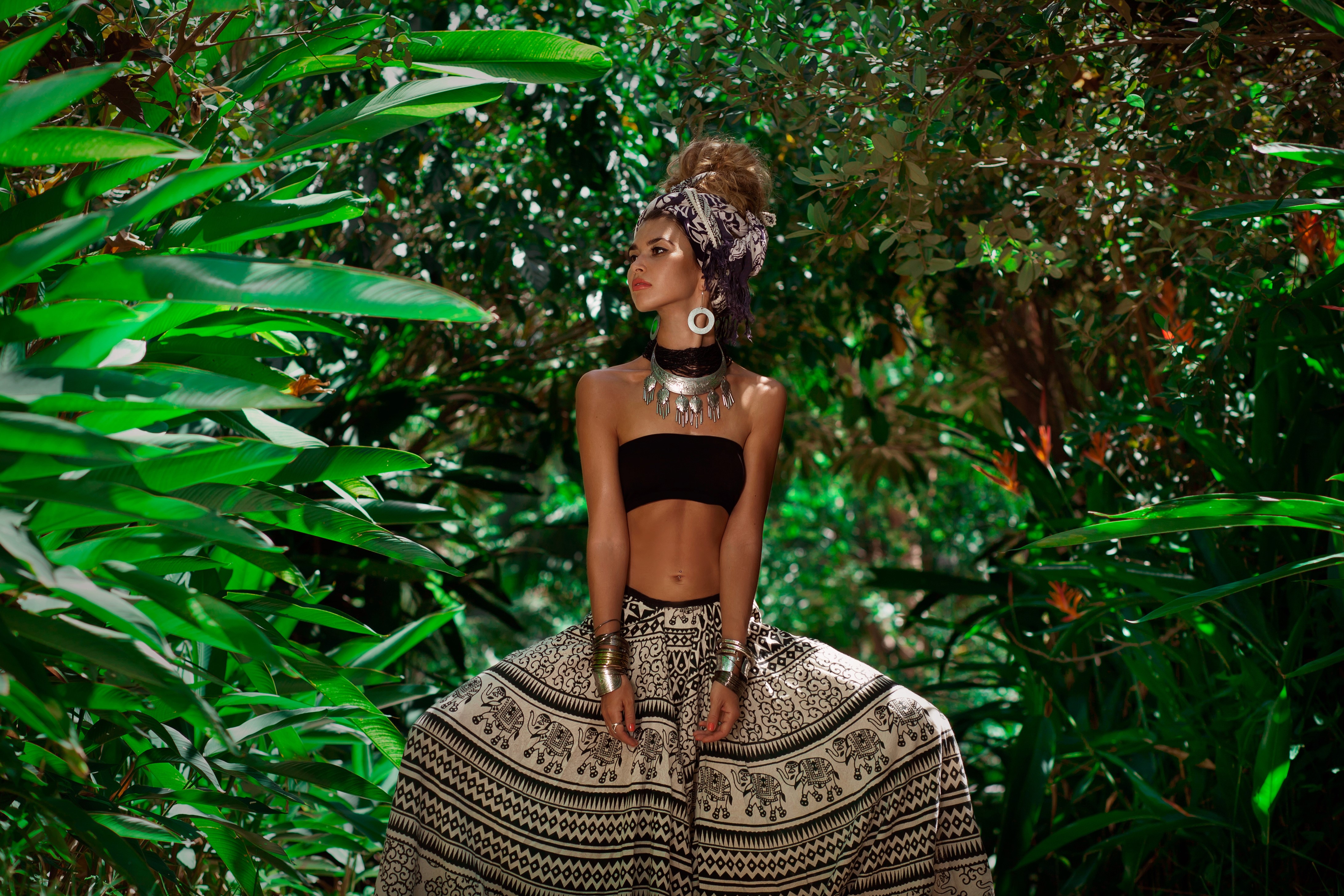 Woman in tribal attire in a jungle HD Wallpaper