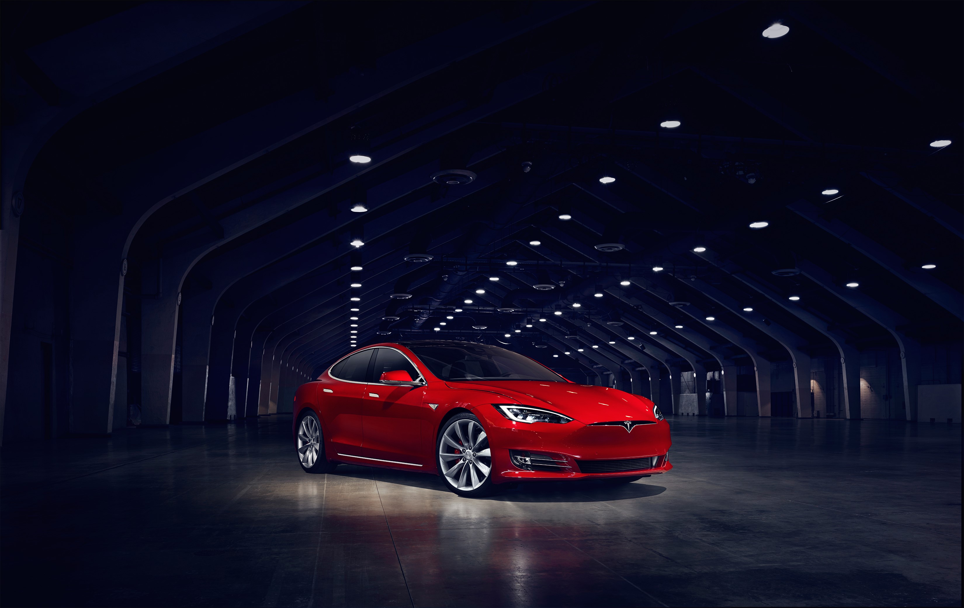 Red Tesla Model S P90D in a dark tunnel HD Wallpaper