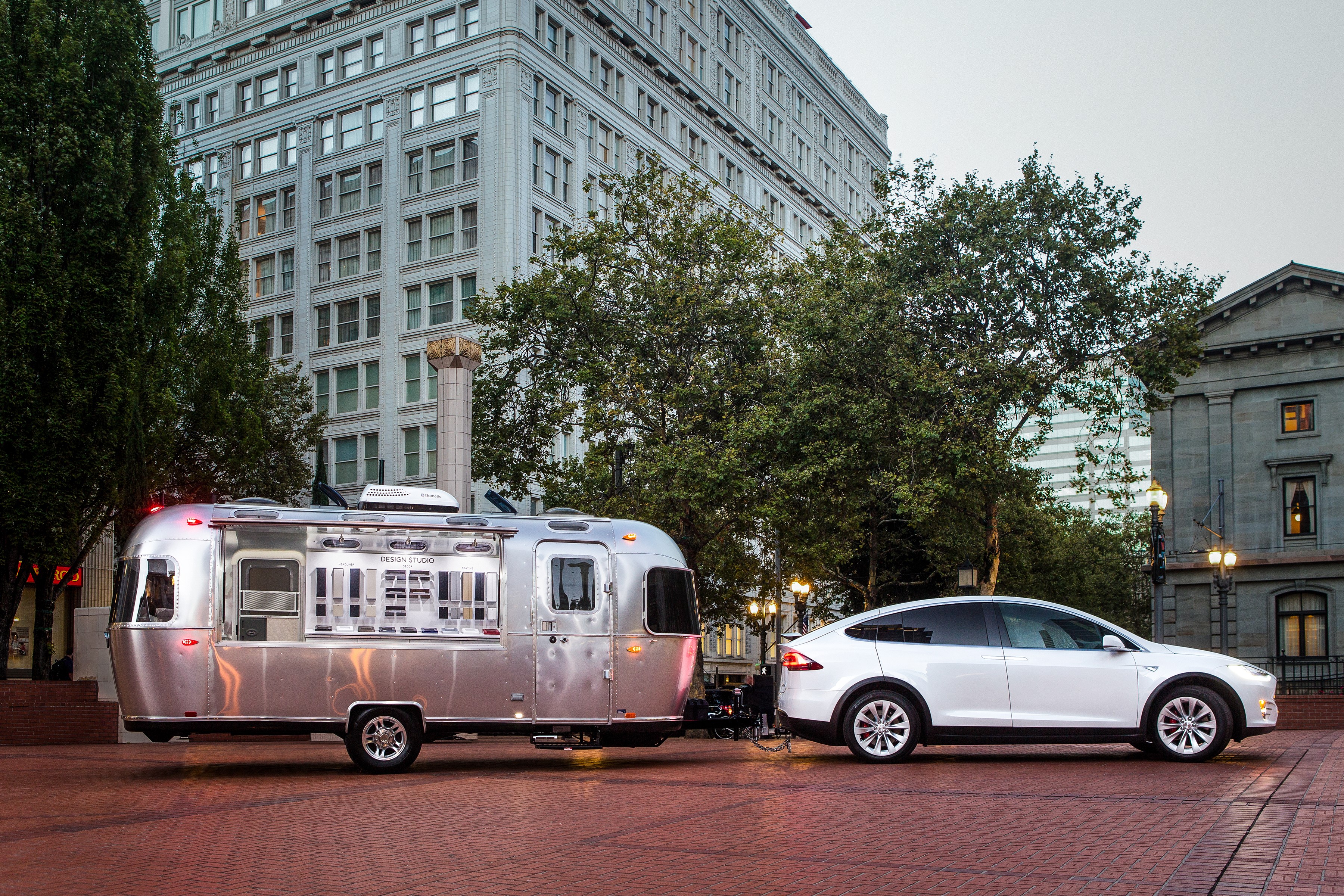White Tesla Model X towing Airstream trailer HD Wallpaper