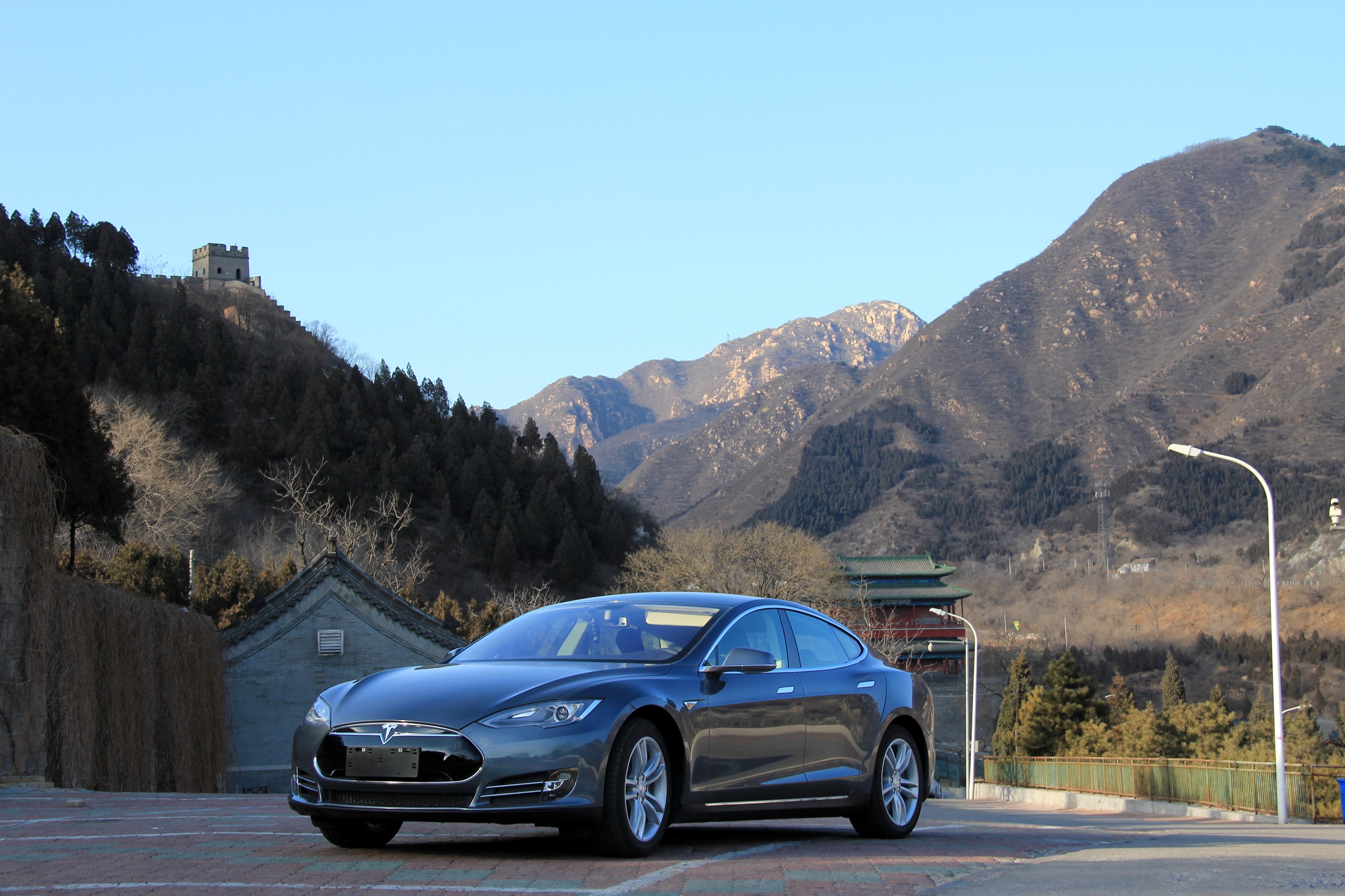 Grey Tesla Model S P85D parked near Great Wall of China HD Wallpaper
