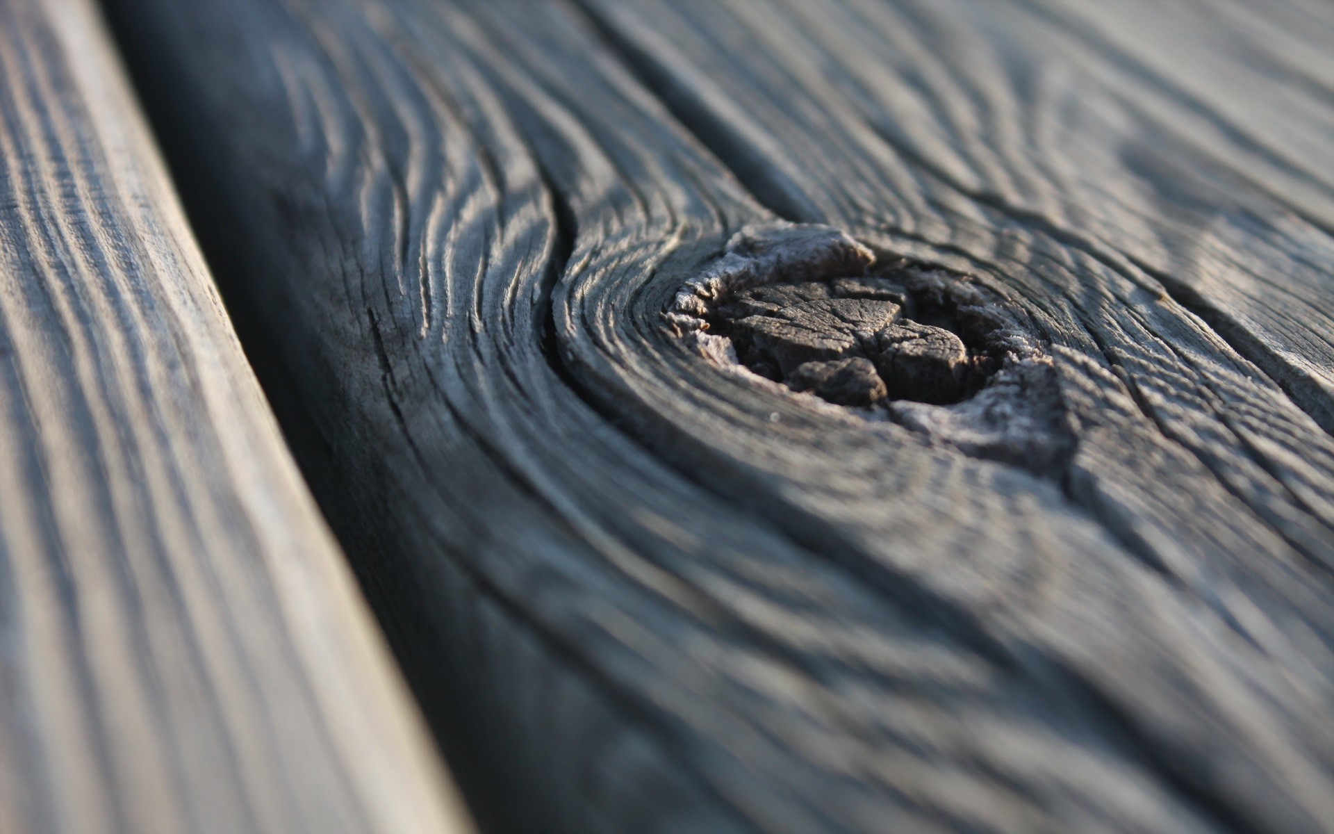 Close-up of weathered wood planks with a knot HD Wallpaper