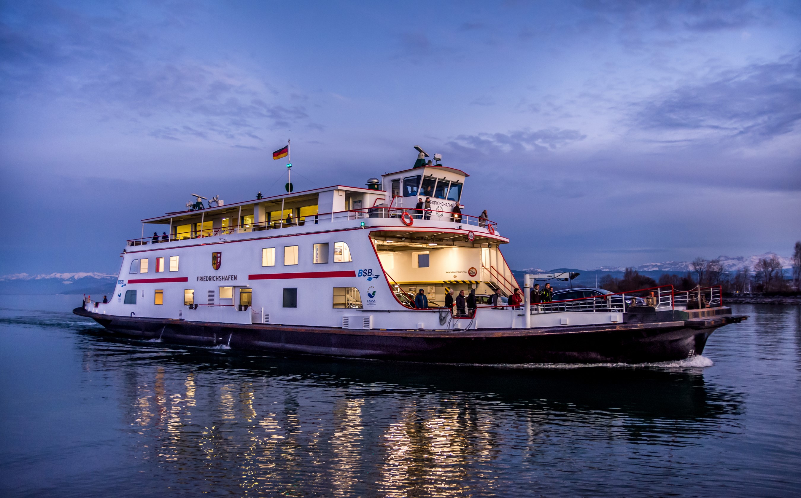 Ferry 'Friedrichshafen' on a lake at dusk HD Wallpaper