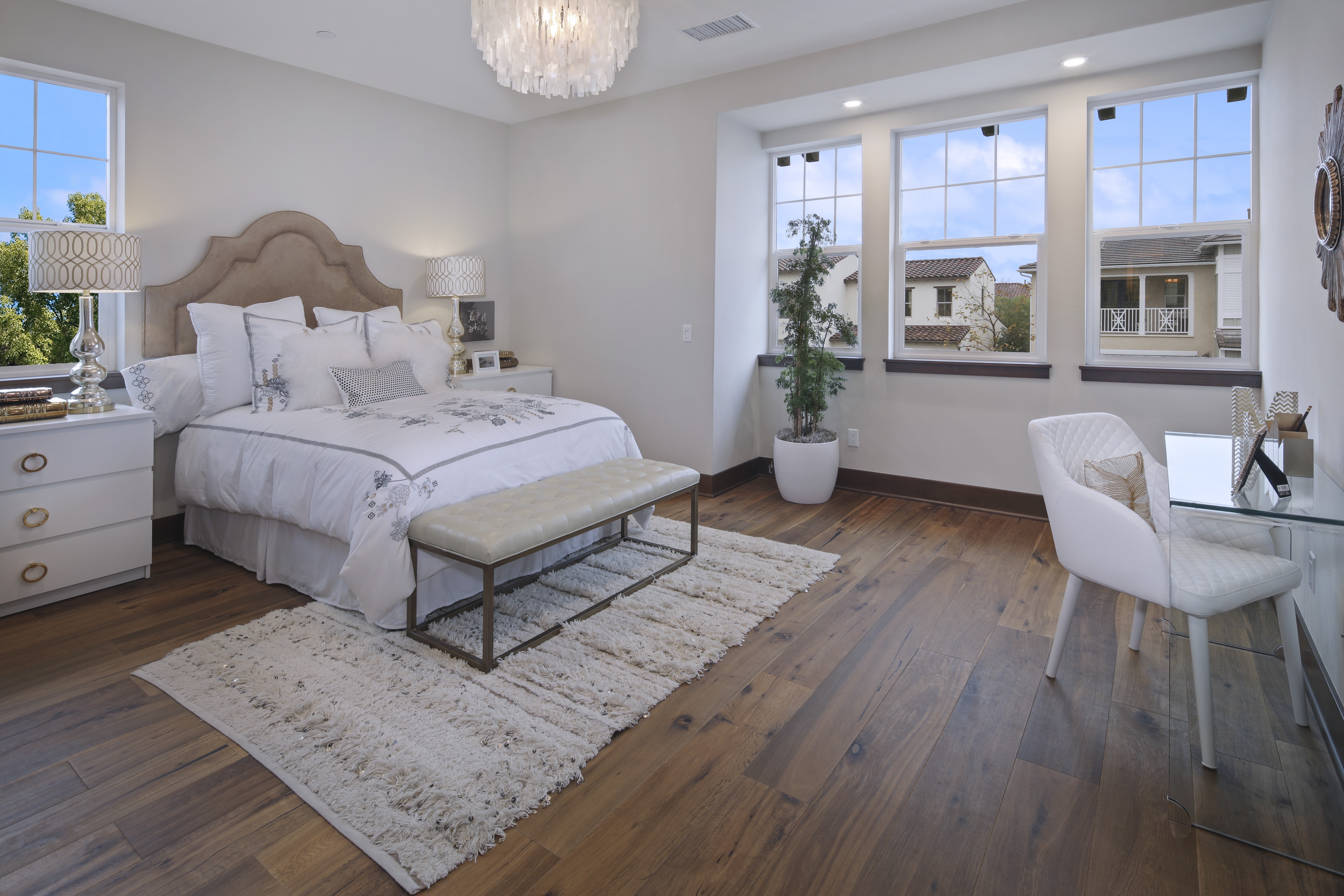 Bedroom with bed, pillows, chairs, and desk HD Wallpaper