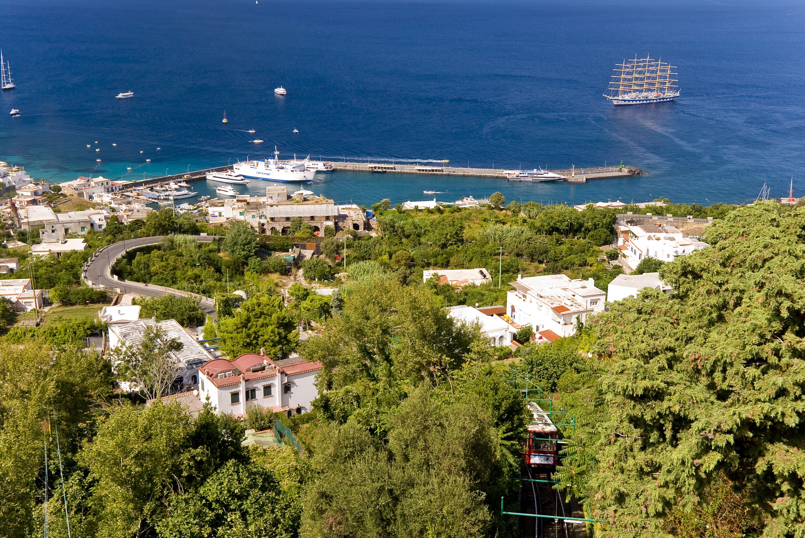 Coastal town with harbor and sailing ship HD Wallpaper