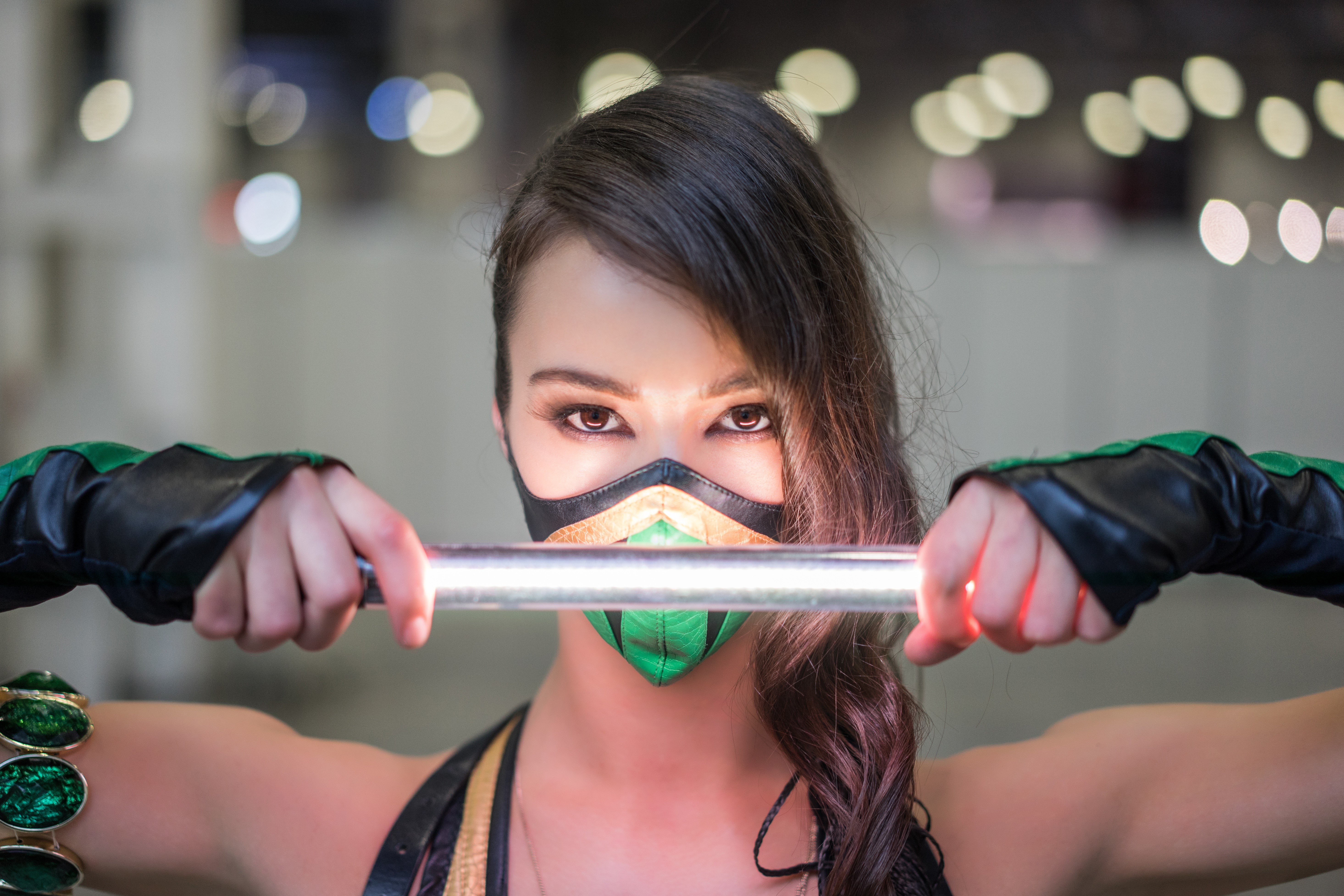 Woman in Mortal Kombat Mileena Cosplay Holding a Light Stick HD Wallpaper