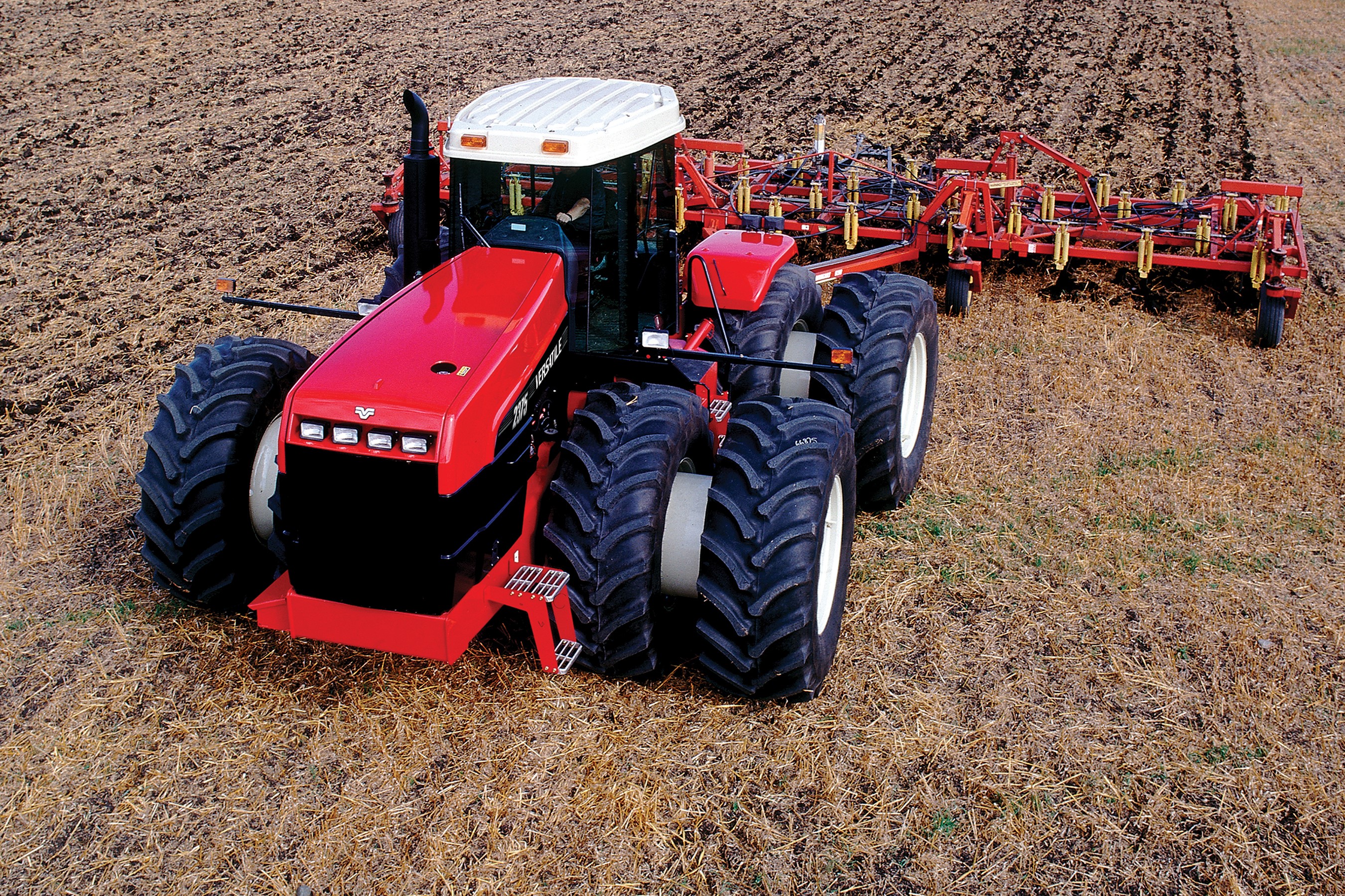 Red Versatile 2375 Tractor Tilling a Field HD Wallpaper