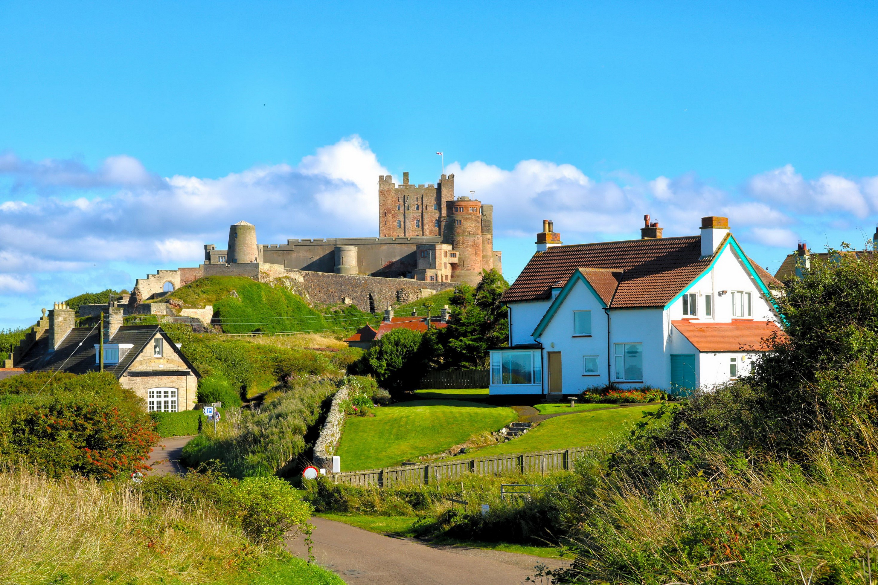 Bamburgh Castle and houses in England HD Wallpaper