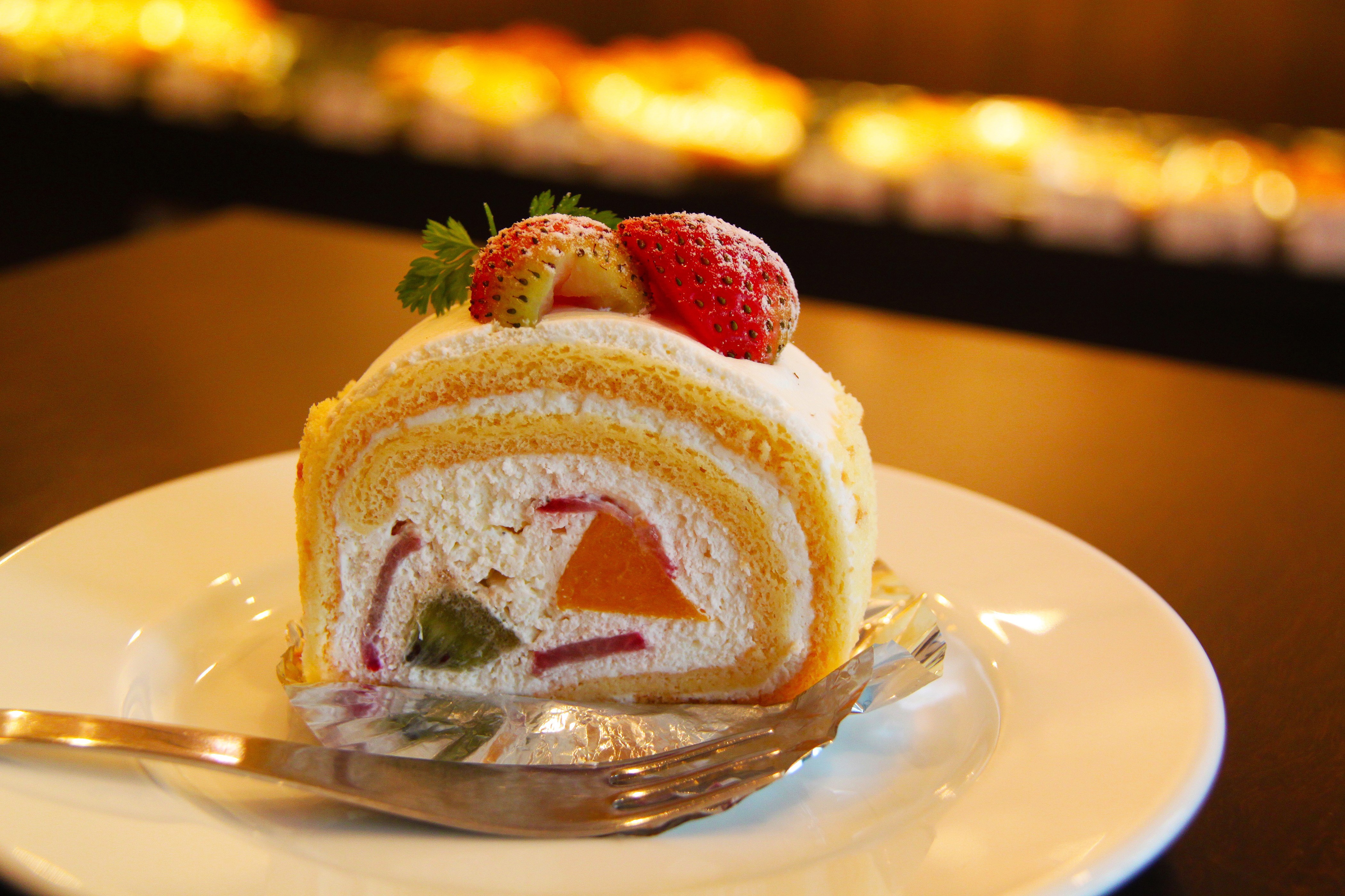 Slice of Swiss Roll Cake with Strawberries HD Wallpaper