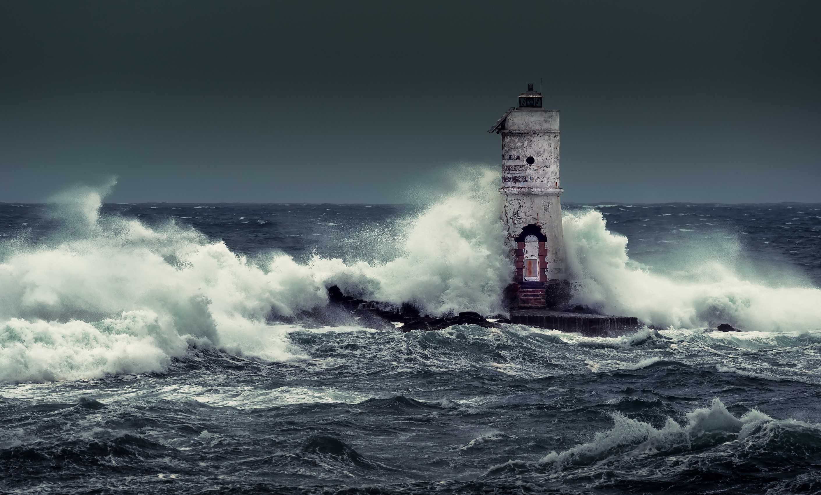 Mangiabarche lighthouse in Calasetta, Italy during a storm HD Wallpaper